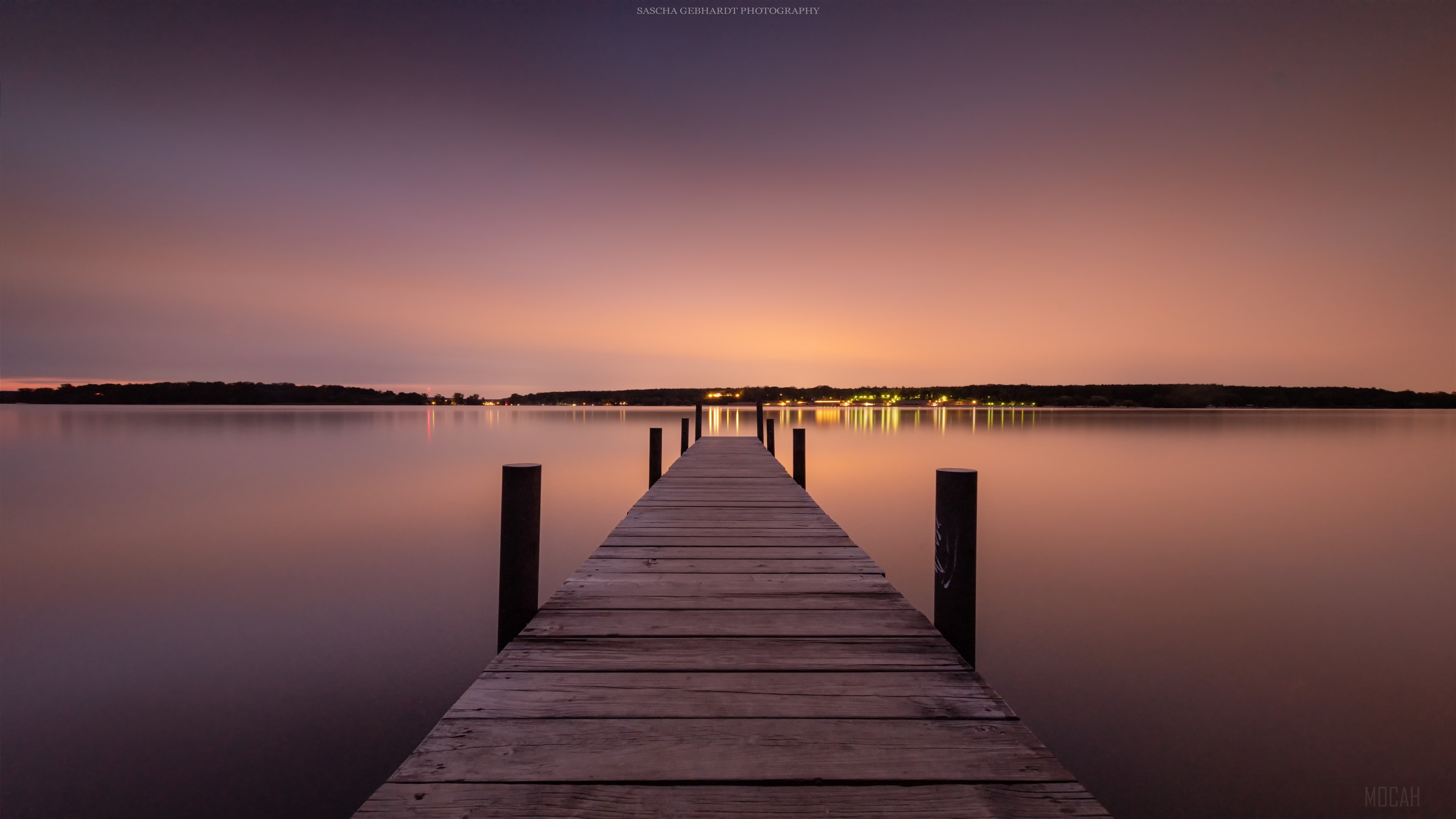 Wooden pier on a lake at dusk 4K HD Wallpaper