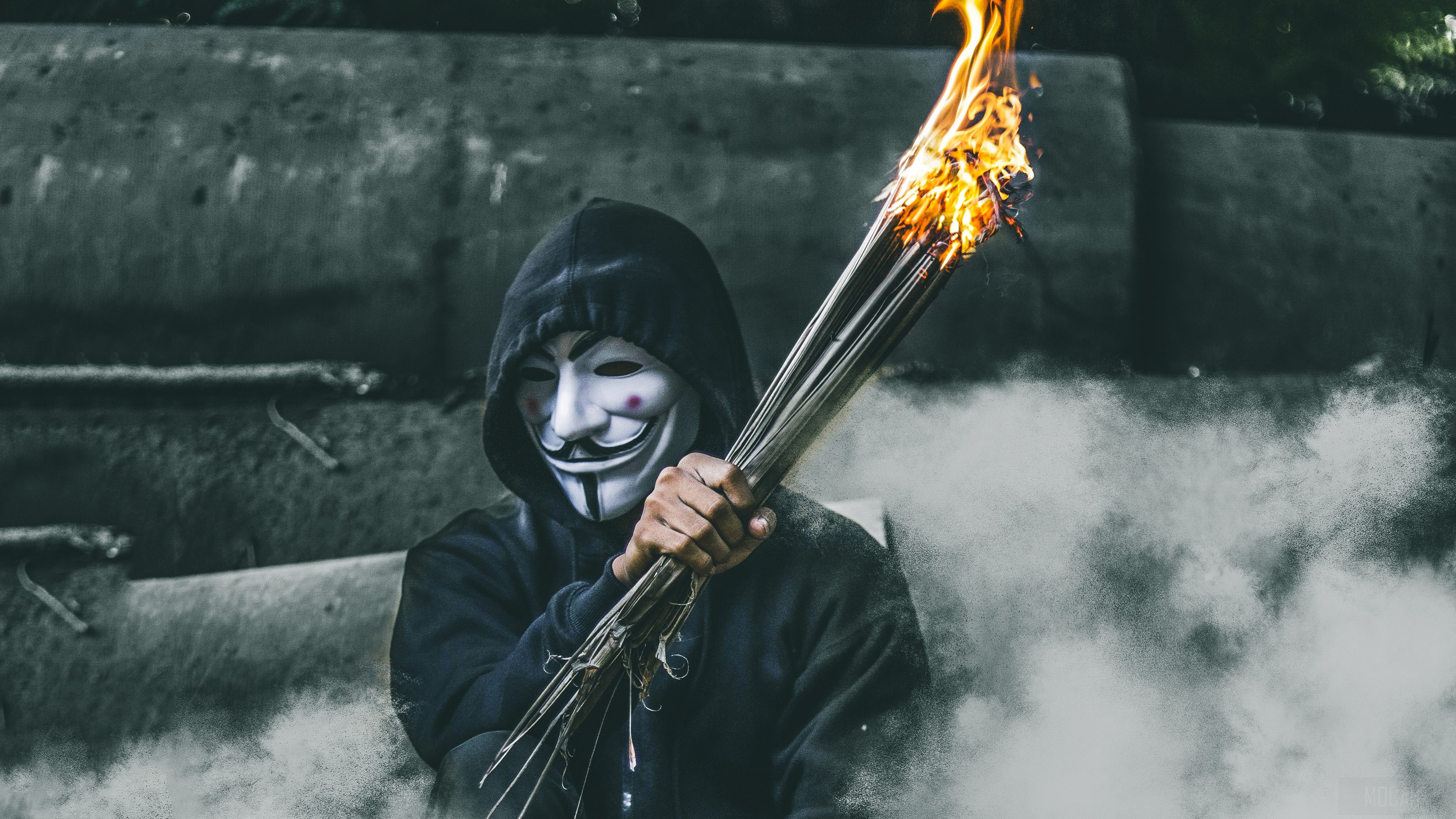 Guy in Guy Fawkes mask holding burning bundle HD Wallpaper