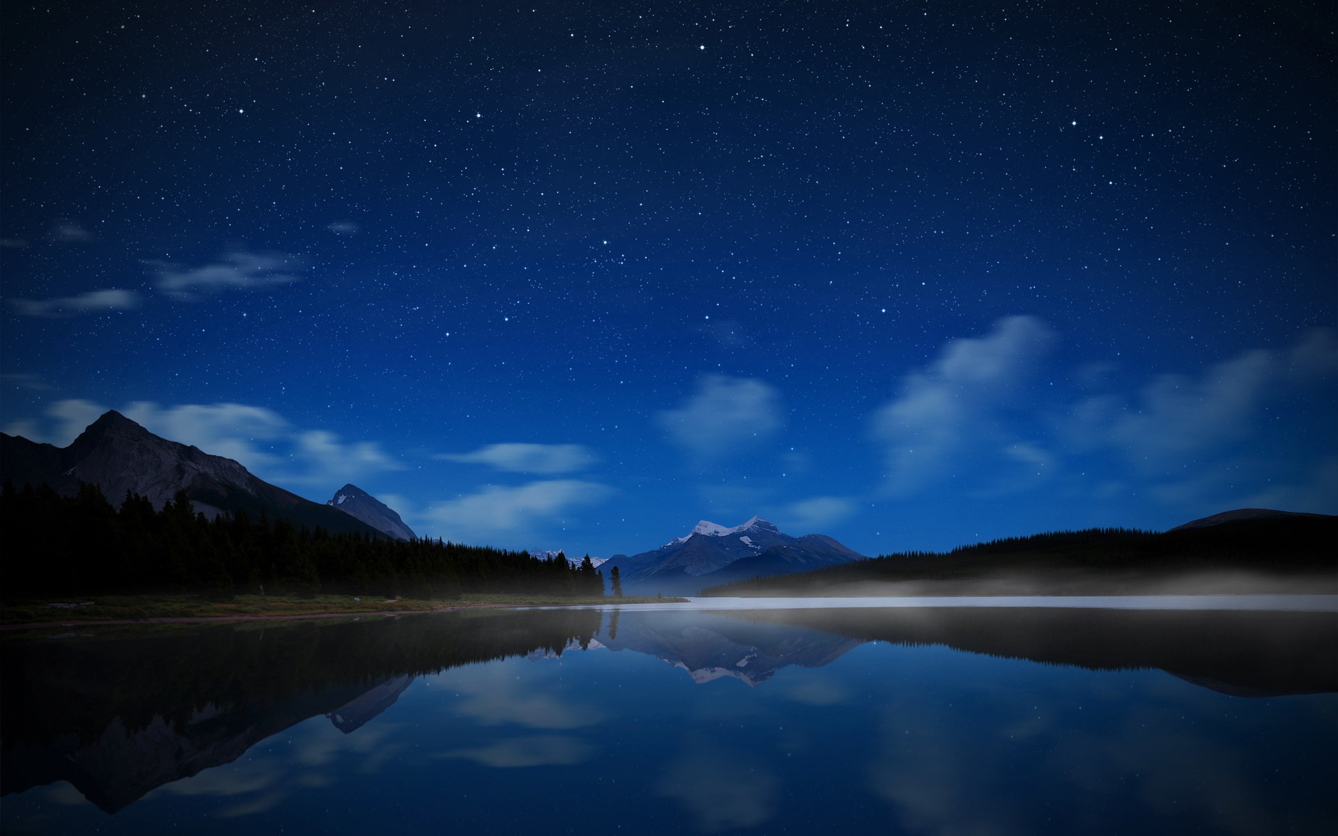Night sky over a misty lake and mountains HD Wallpaper