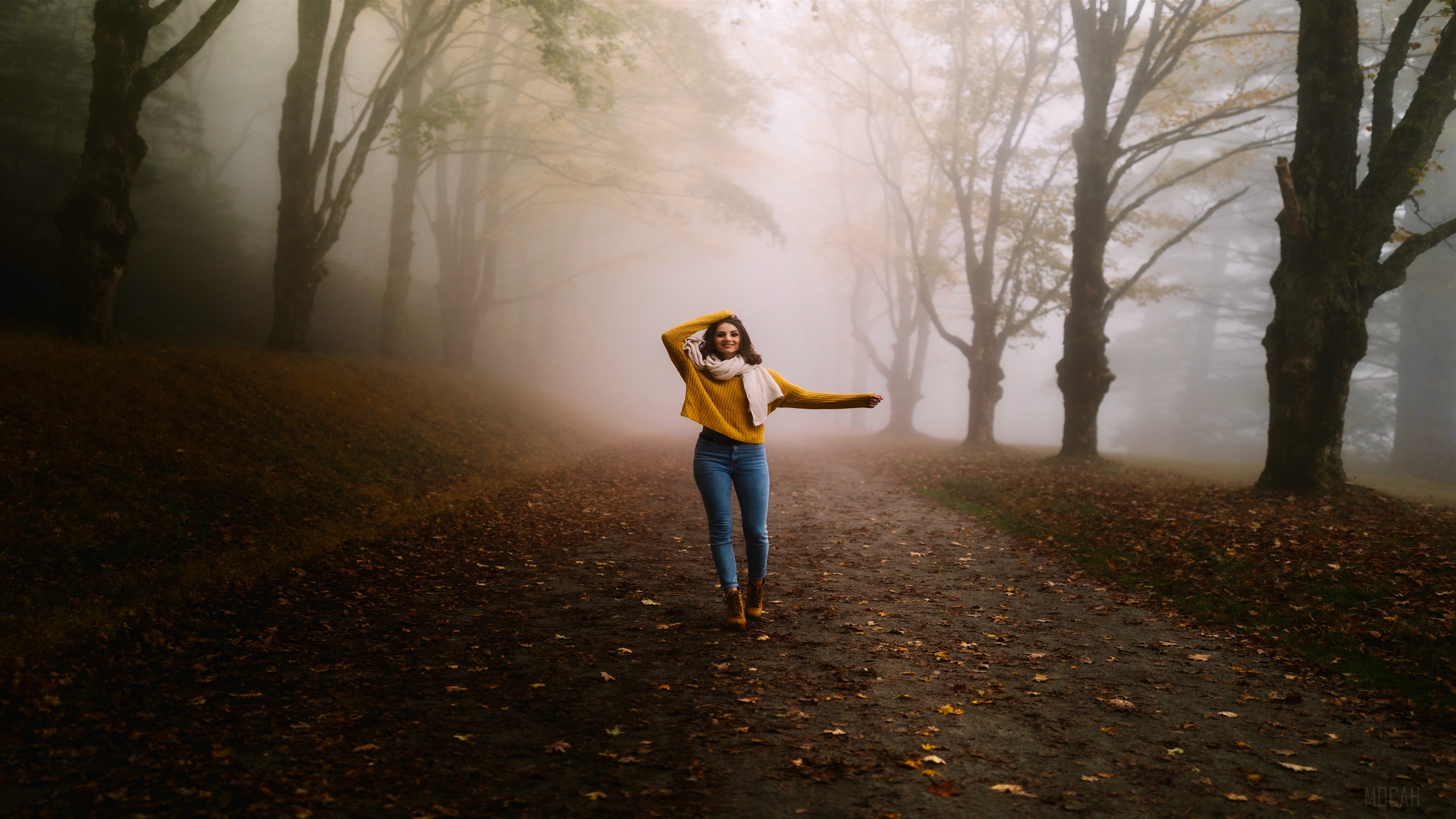 Girl walking on a foggy road in autumn HD Wallpaper