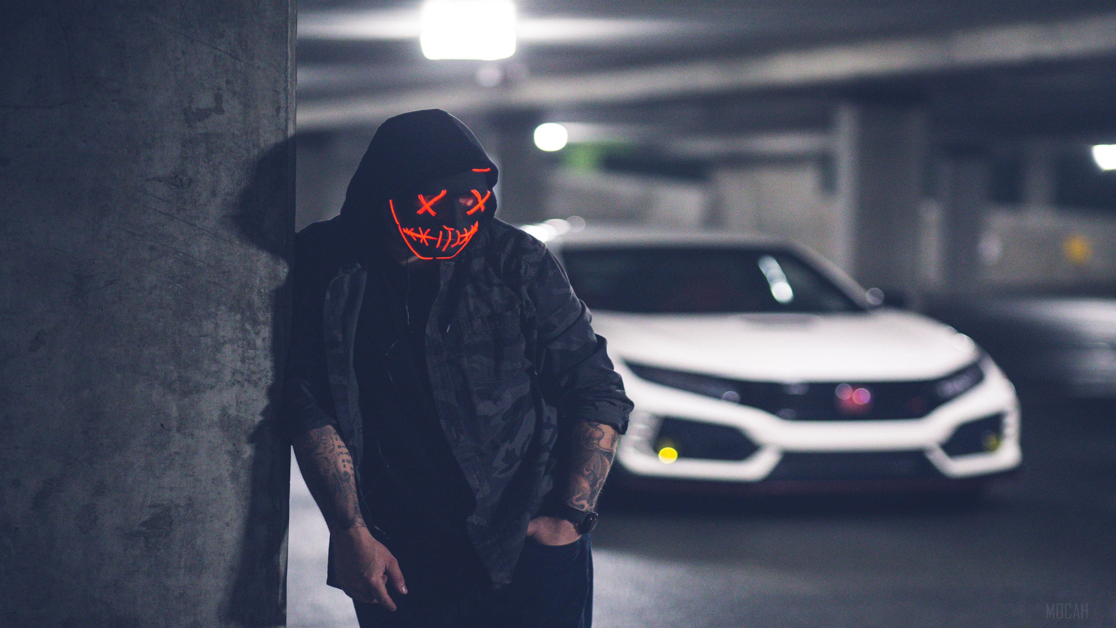 Man in Neon Mask with White Car in Parking Garage 4K HD Wallpaper