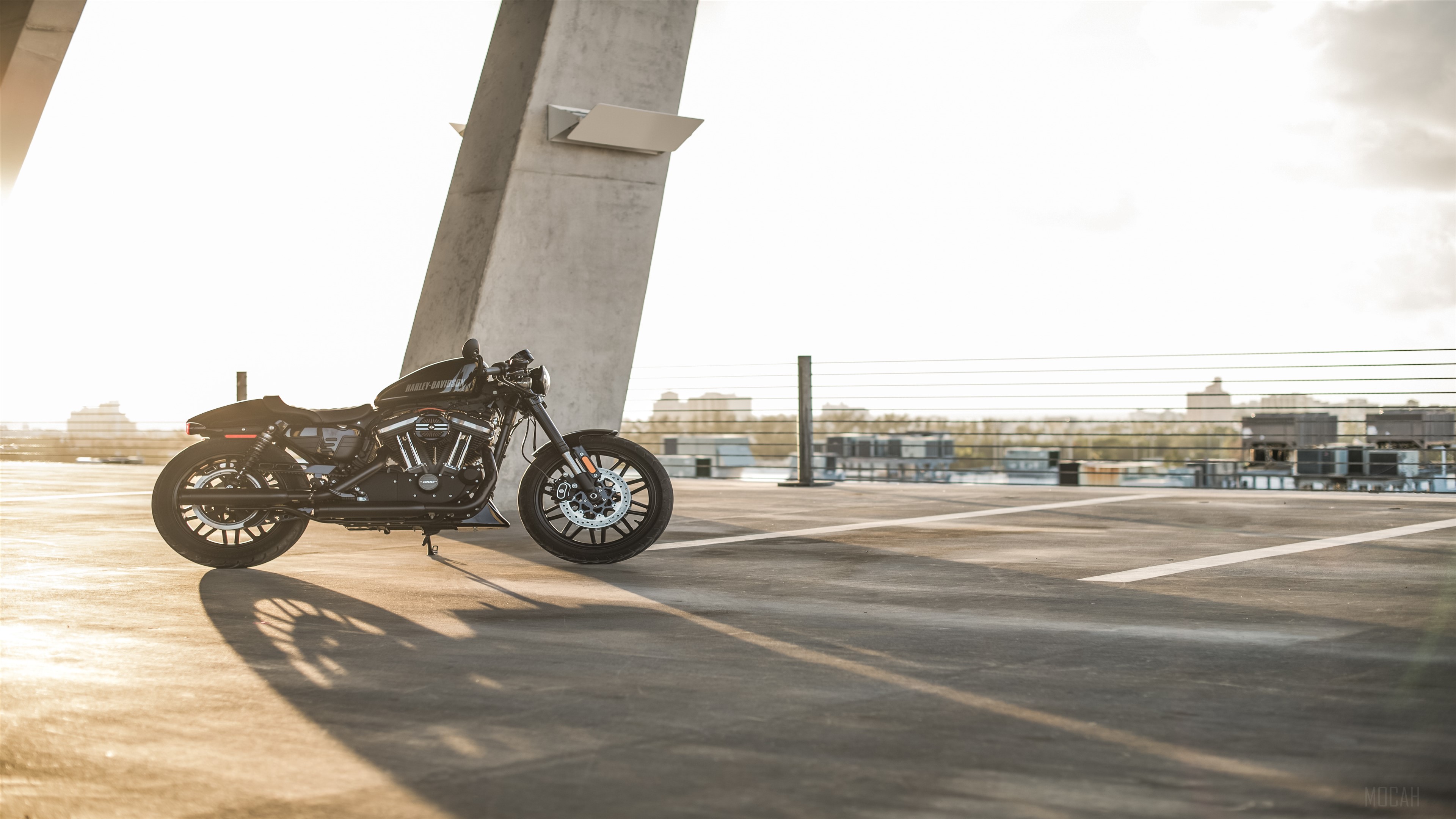 Harley Davidson motorcycle parked on rooftop HD Wallpaper