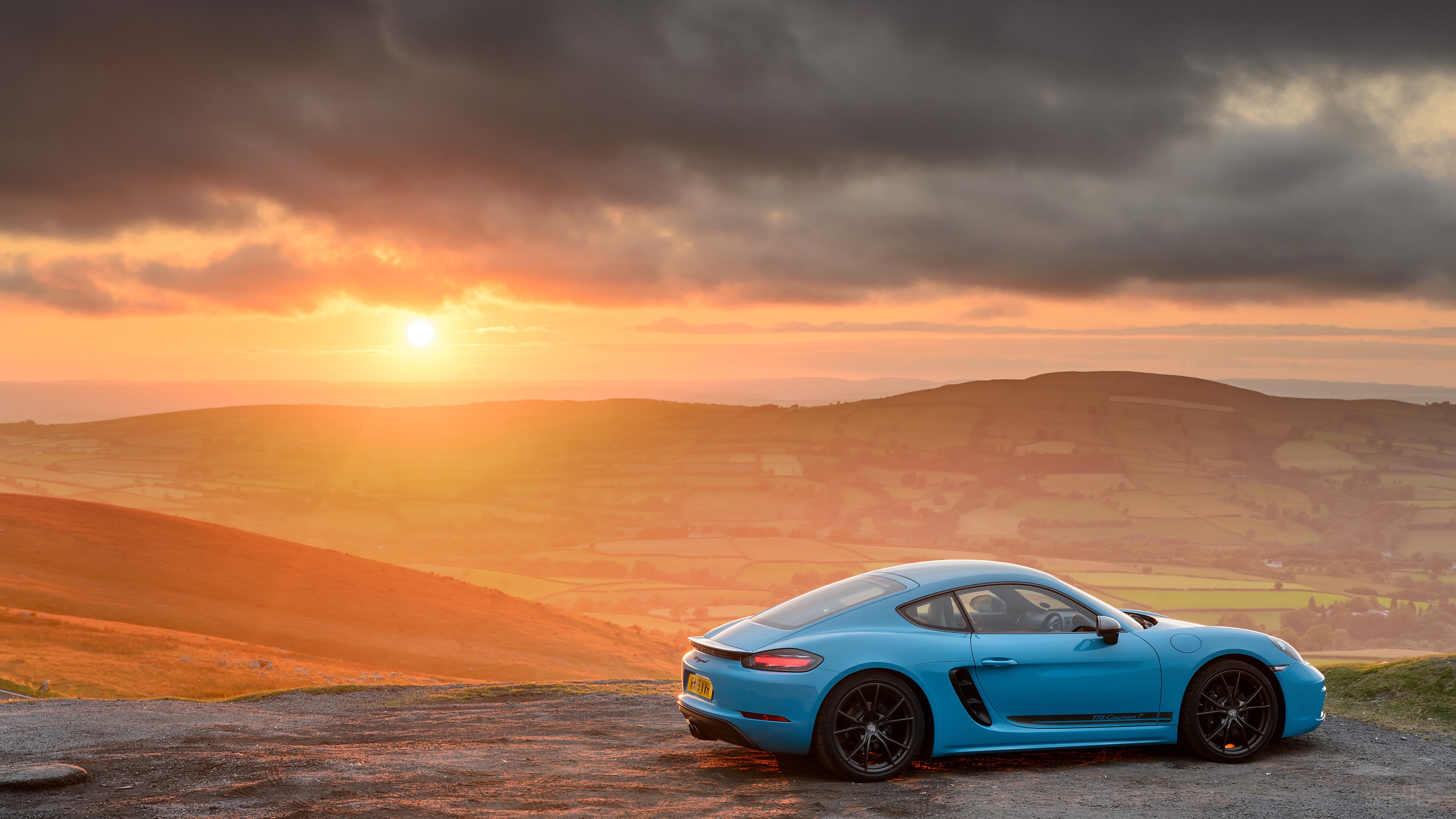 Blue Porsche 718 Cayman T at sunset HD Wallpaper