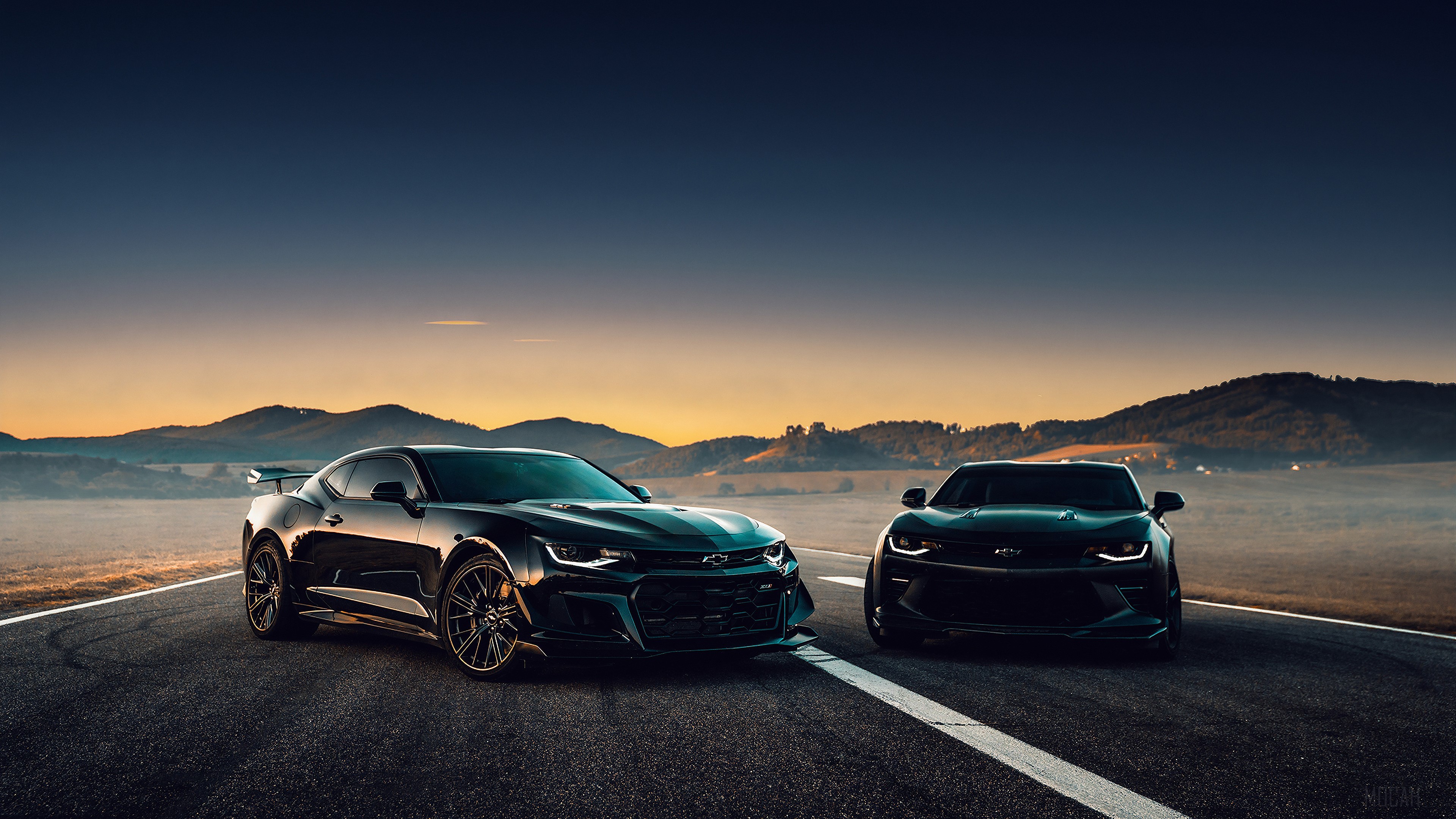 Two Black Chevrolet Camaros on a Road at Sunset 4K HD Wallpaper
