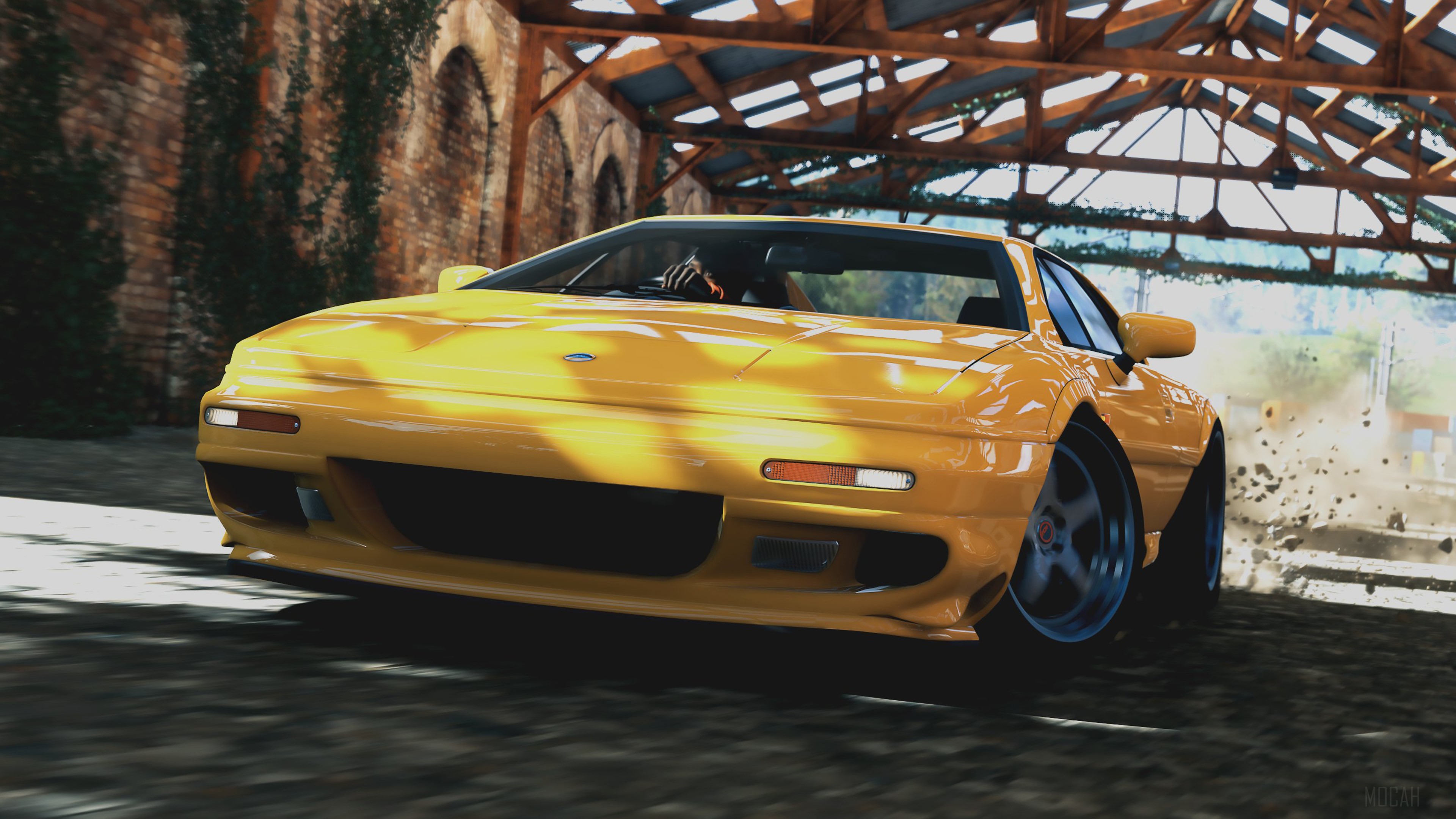 Yellow Lotus Esprit driving on dirt road HD Wallpaper