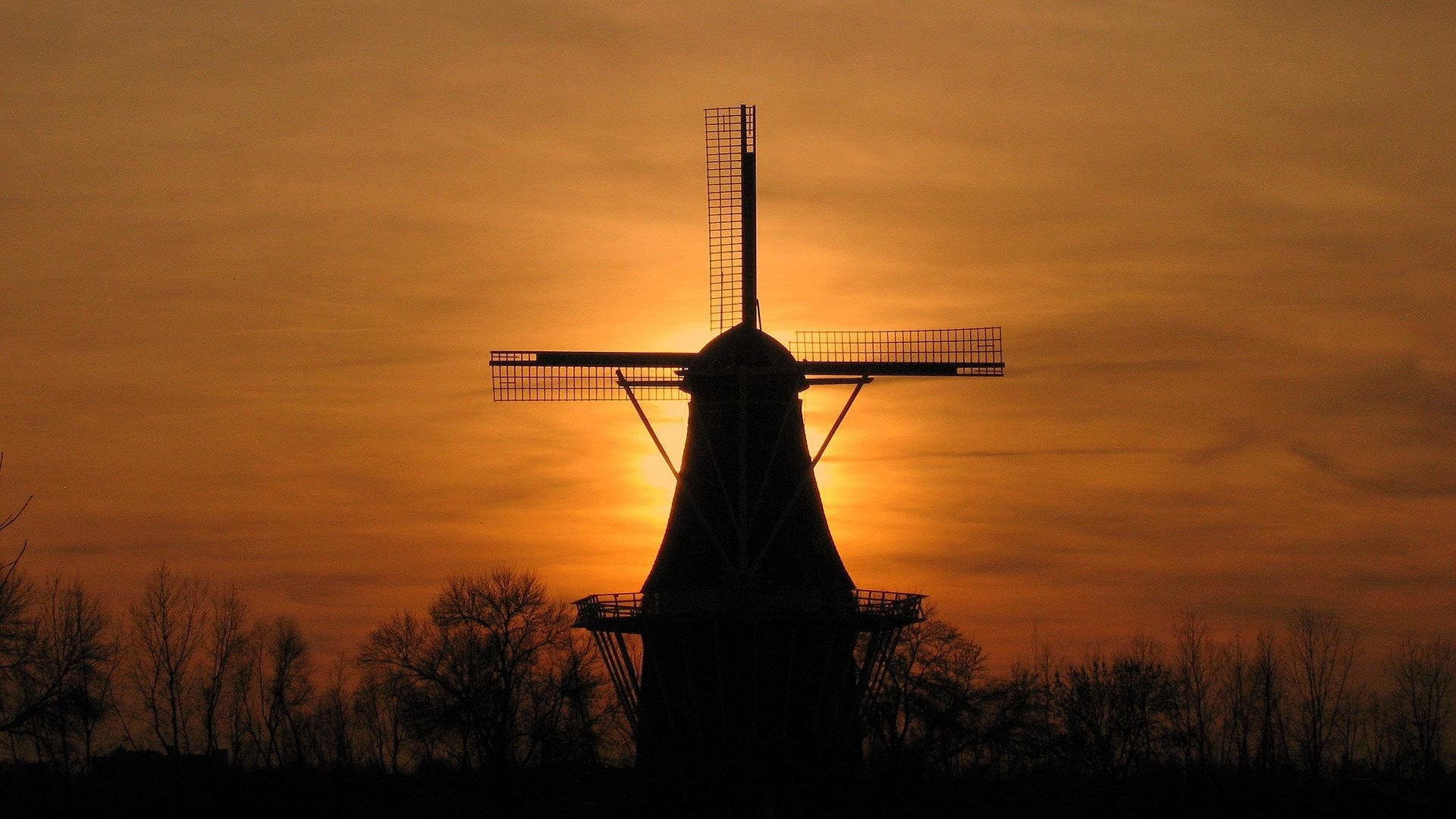 Silhouette of a windmill at sunset HD Wallpaper