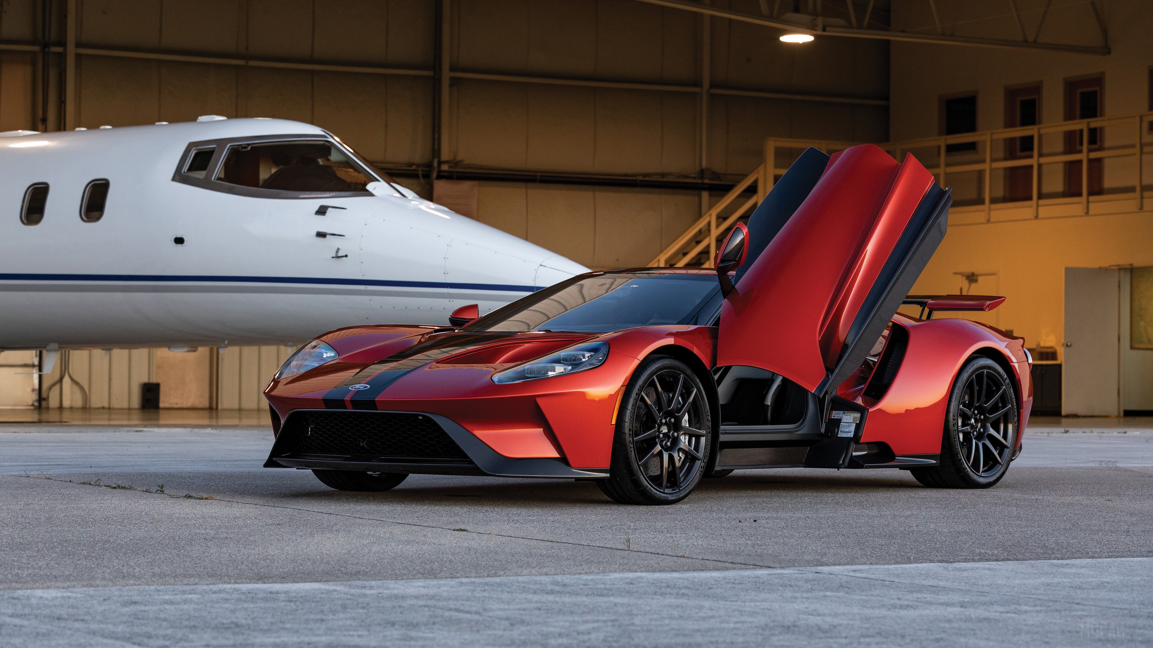 Red Ford GT with Butterfly Doors and Private Jet HD Wallpaper