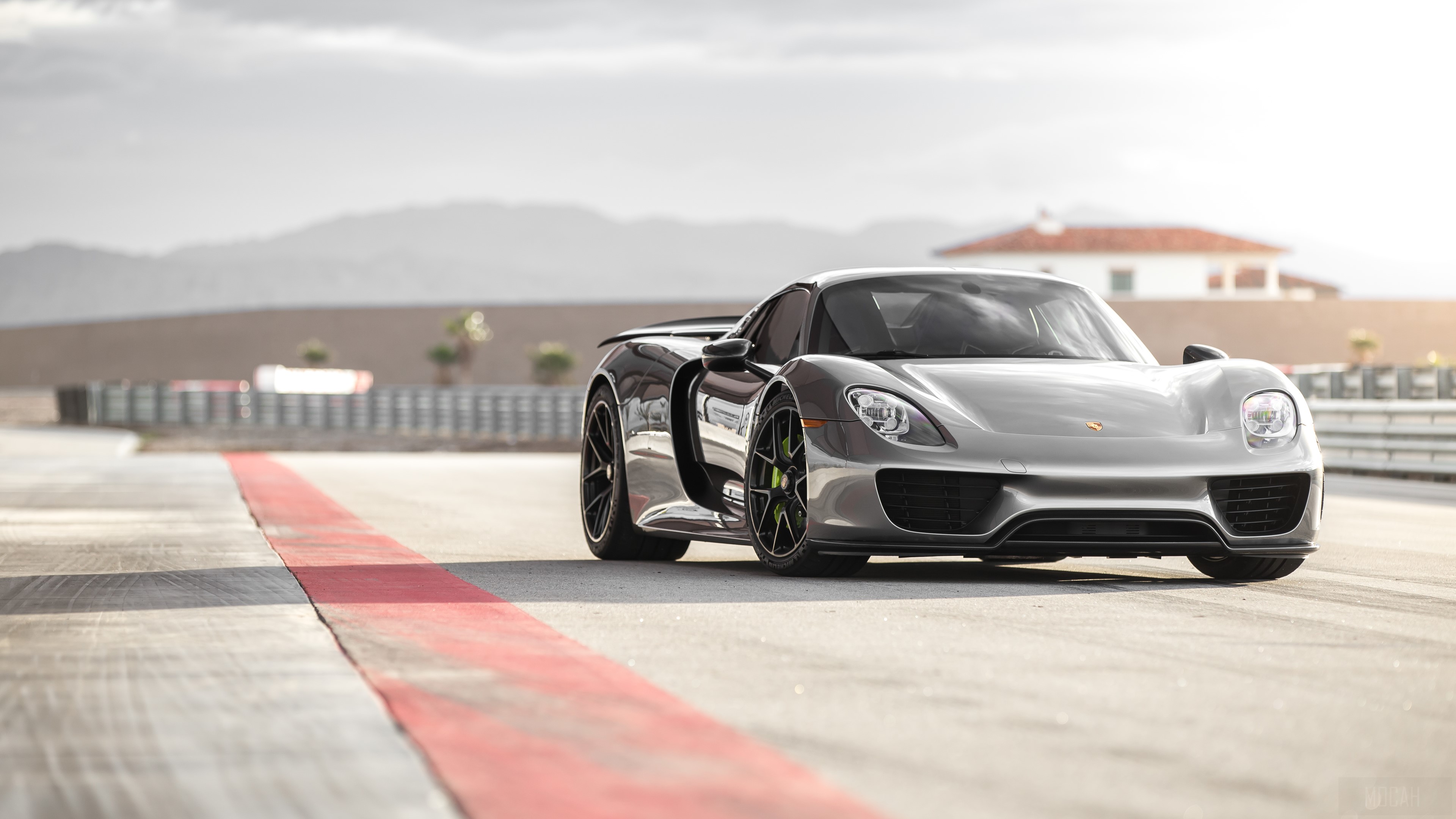 Porsche 918 Spyder on a Racetrack 4K HD Wallpaper
