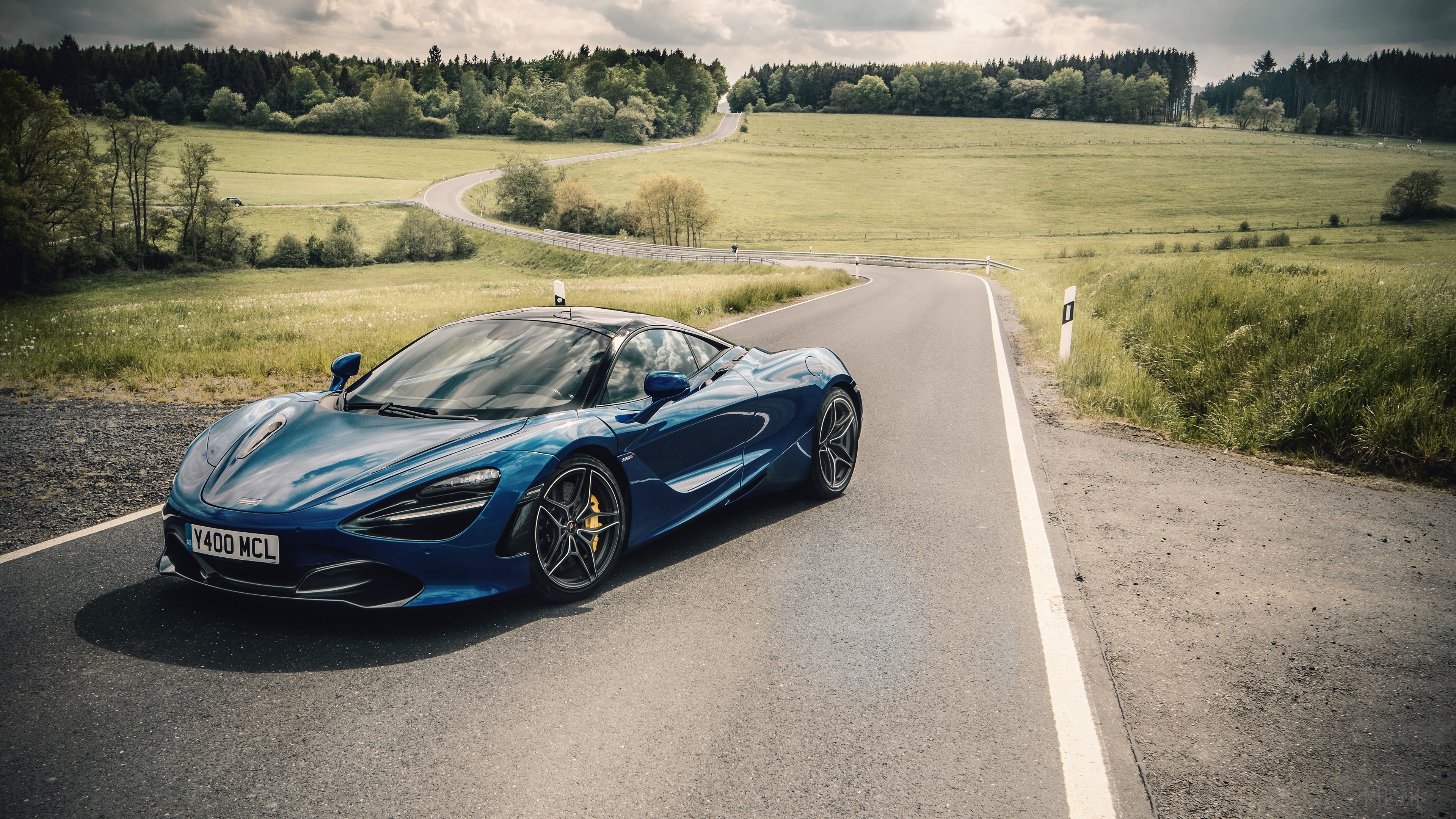 Blue McLaren 720S on a winding road HD Wallpaper