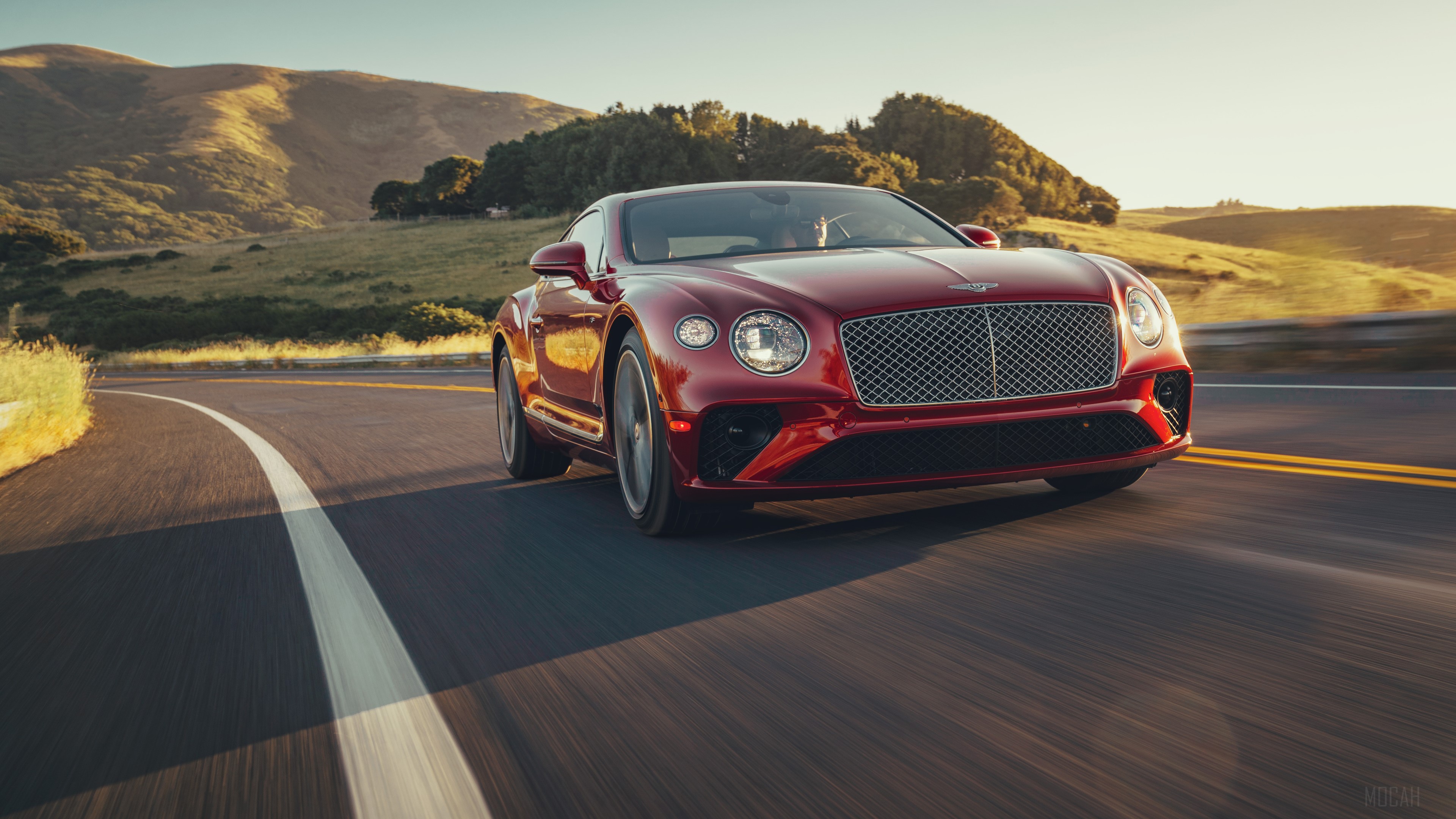 Red Bentley Continental GT V8 2020 driving on a road HD Wallpaper