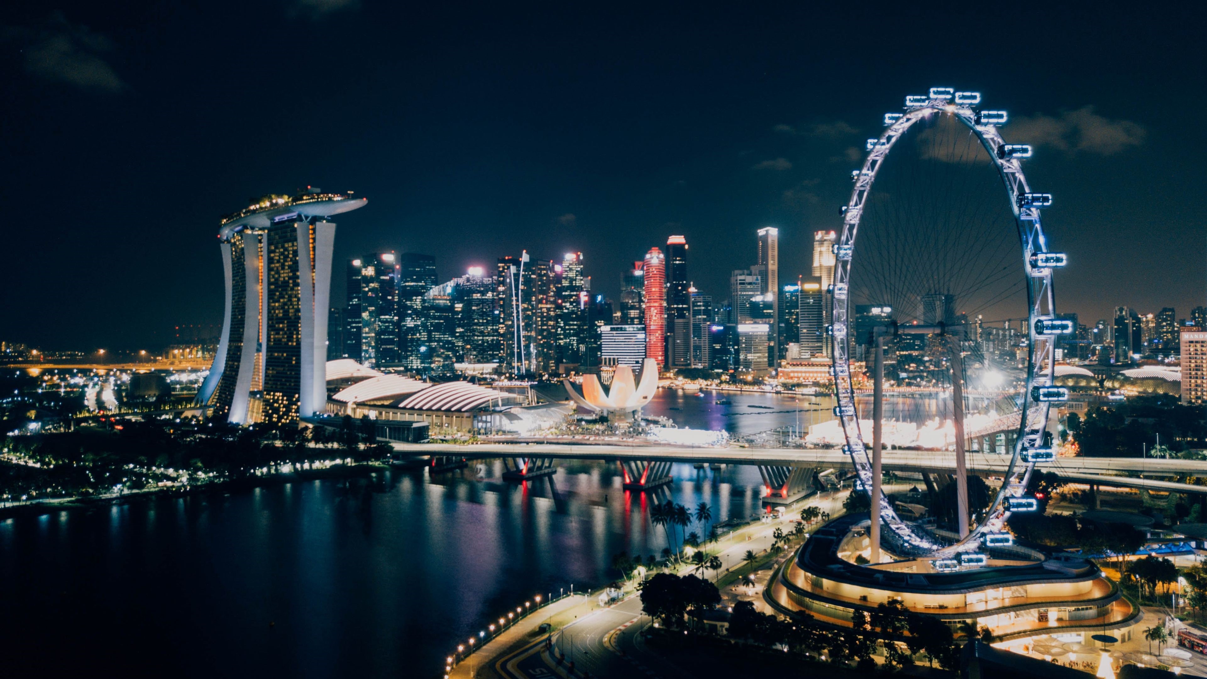 Singapore skyline with Marina Bay Sands and Singapore Flyer at night 4K HD Wallpaper