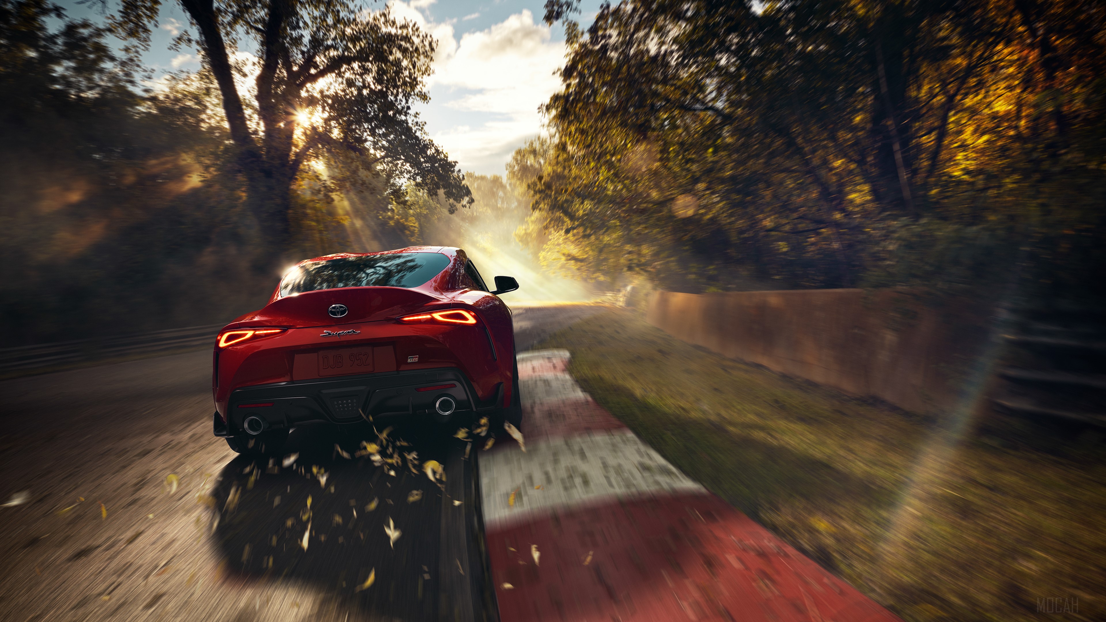 Red Toyota Supra driving on a track HD Wallpaper