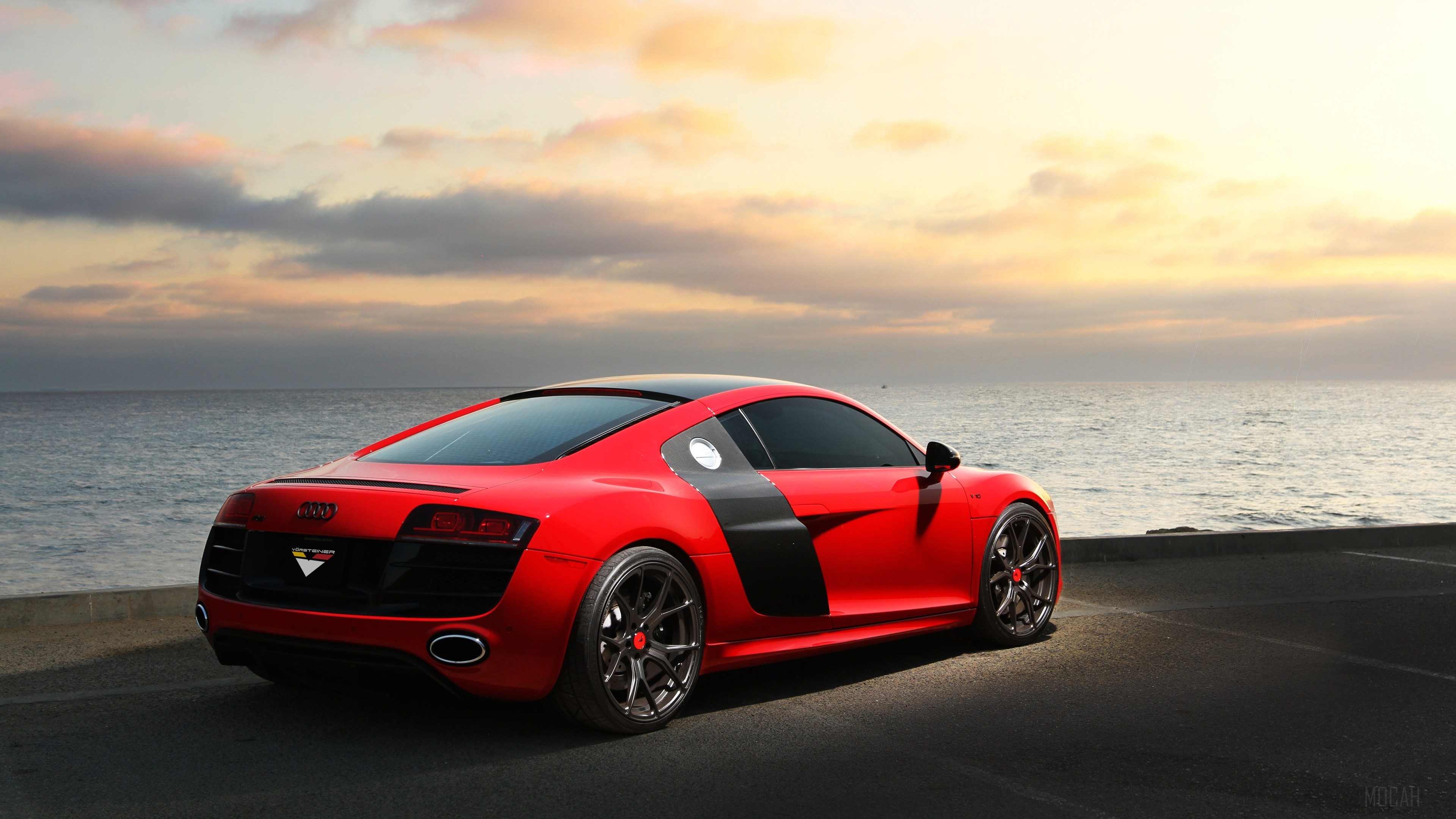 Red Audi R8 parked by the ocean at sunset HD Wallpaper