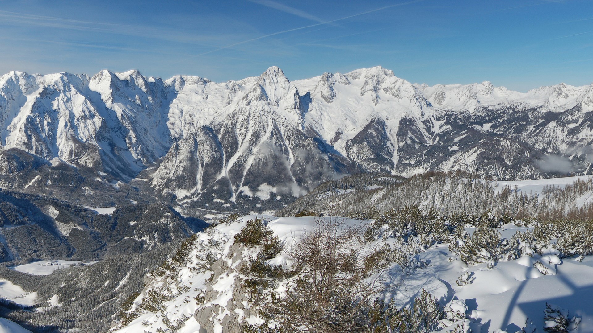 Snow-covered mountains under a clear blue sky HD Wallpaper