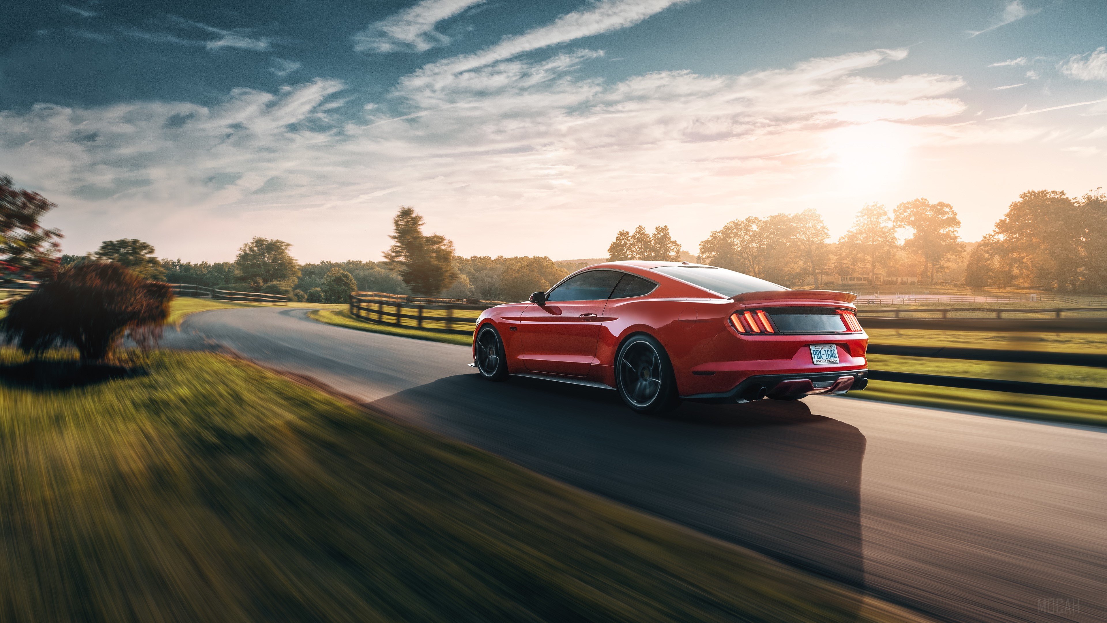 Red Ford Mustang GT driving on a country road HD Wallpaper