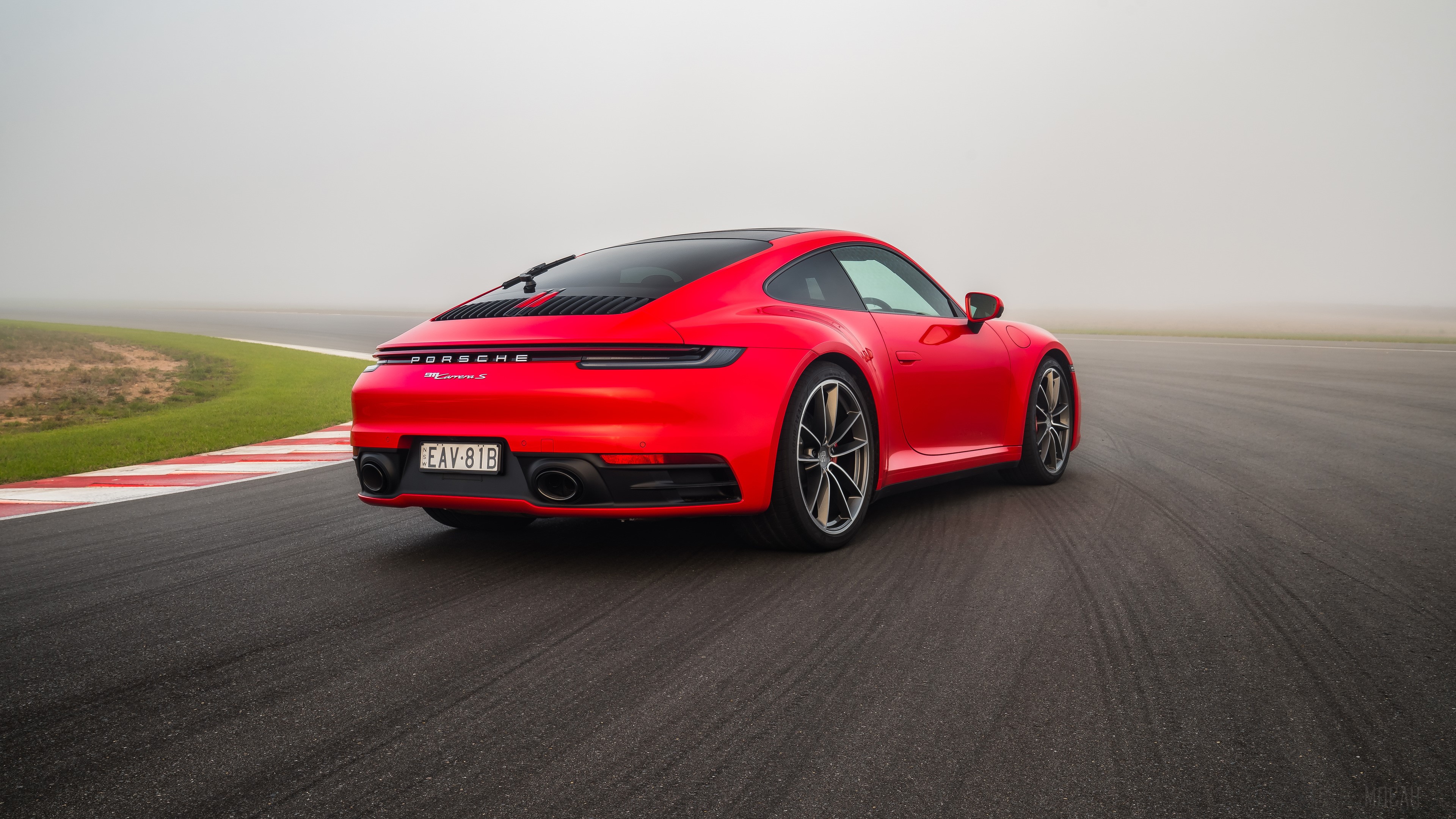 Red Porsche 911 Carrera on a Racetrack HD Wallpaper