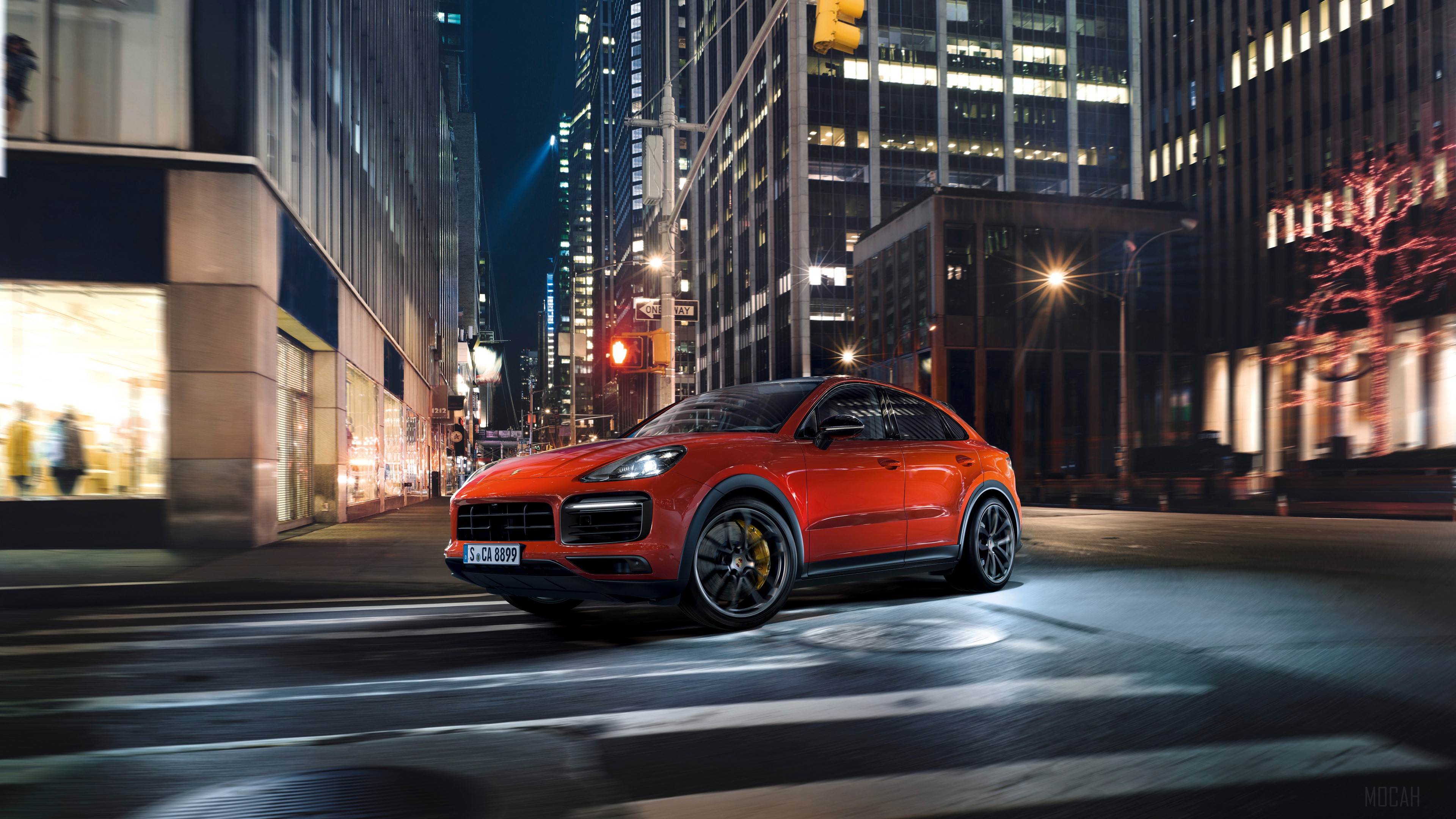 Orange Porsche Cayenne Coupe driving in city at night HD Wallpaper