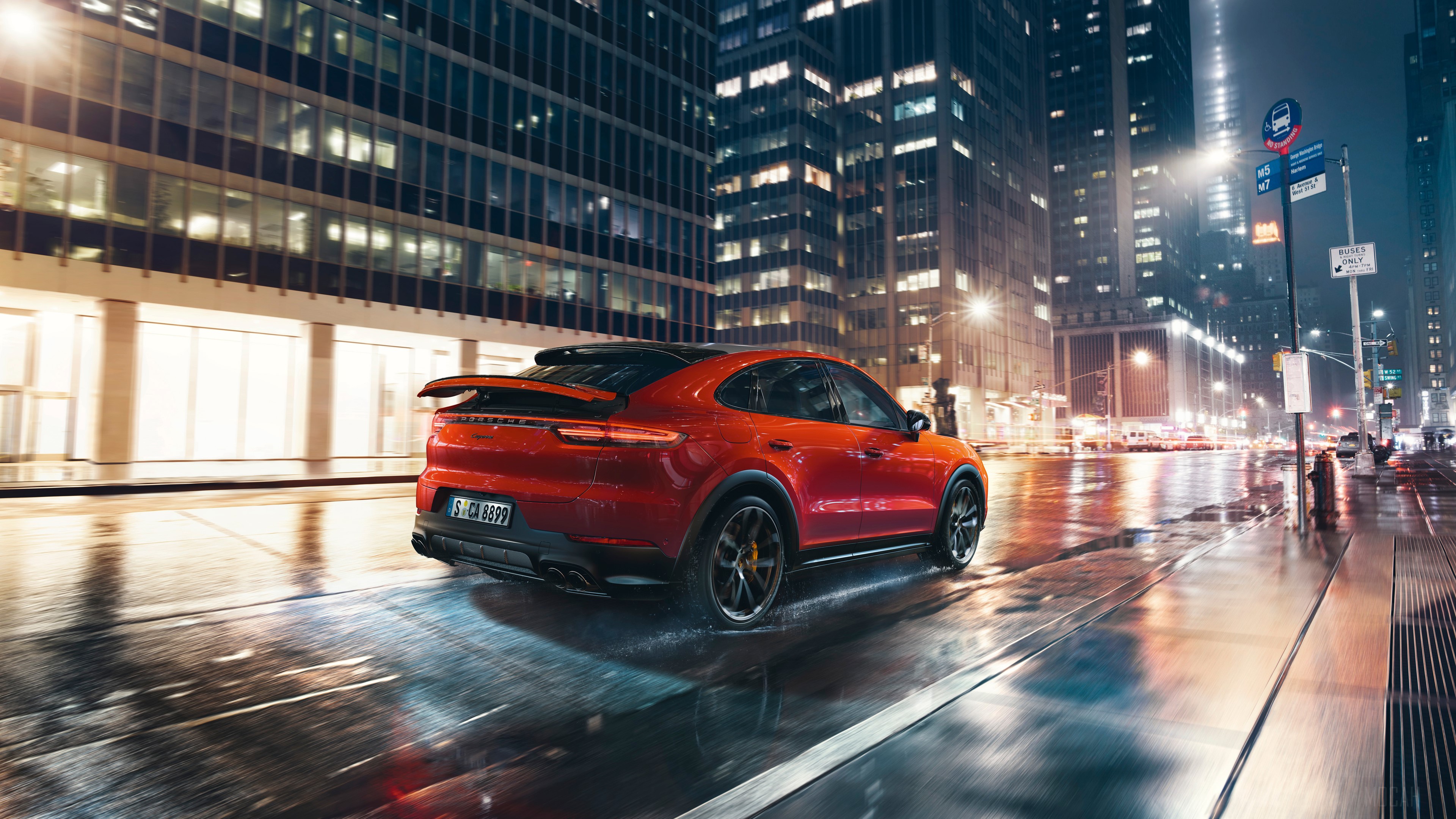 Red Porsche Cayenne Coupe driving on wet city street at night HD Wallpaper