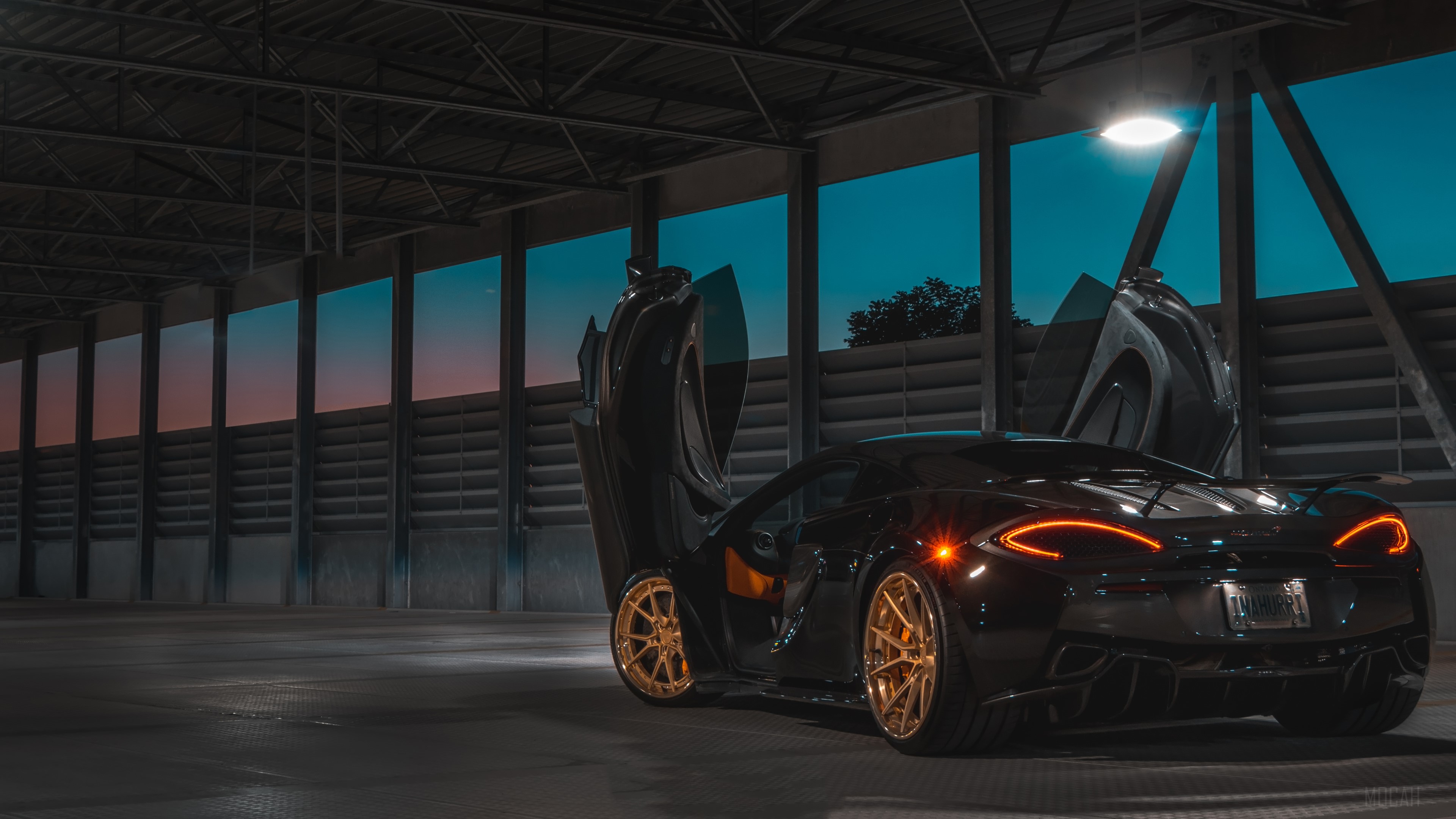 Black McLaren with Gold Wheels in a Garage 4K HD Wallpaper