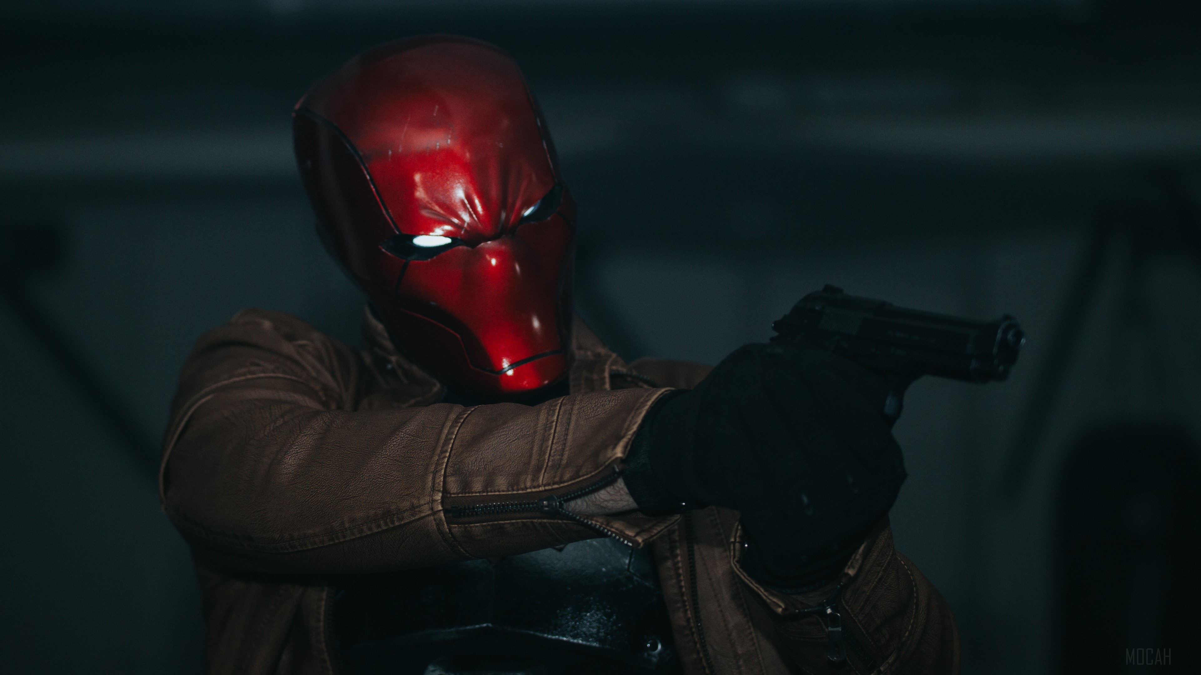 Red Hood aiming a gun HD Wallpaper