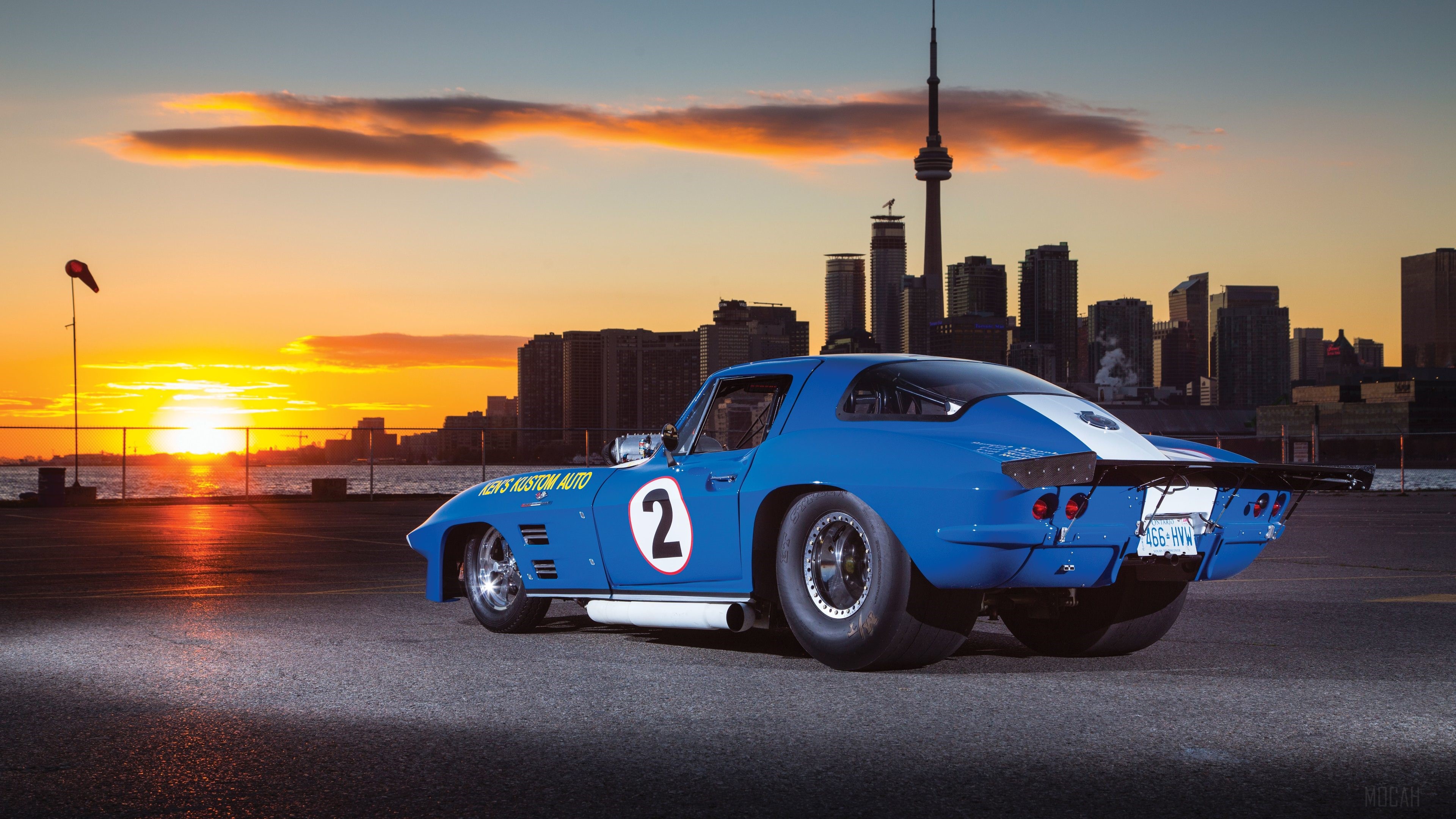 1966 Chevrolet Corvette with CN Tower at Sunset HD Wallpaper