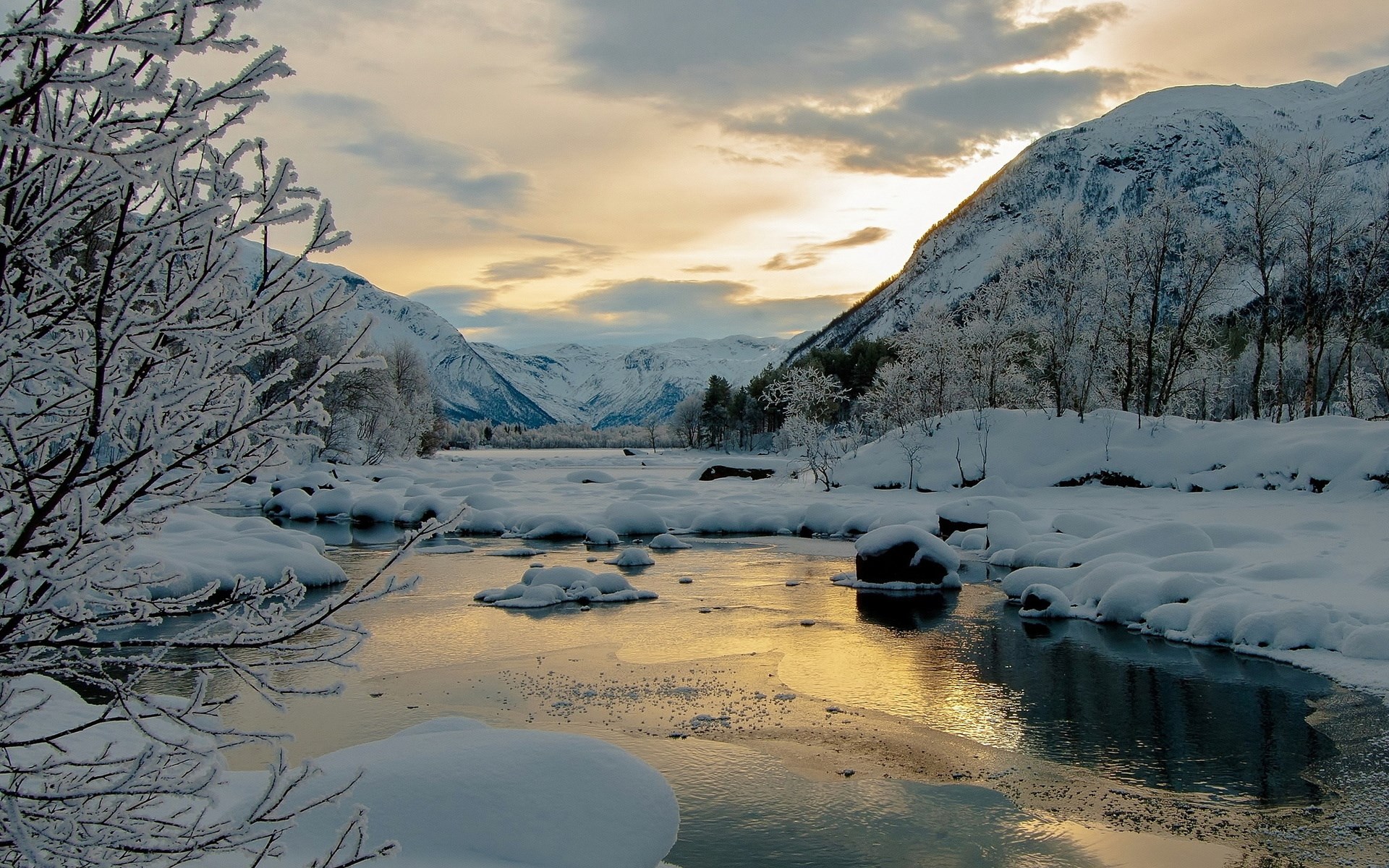 Snowy river valley with mountains at sunset HD Wallpaper