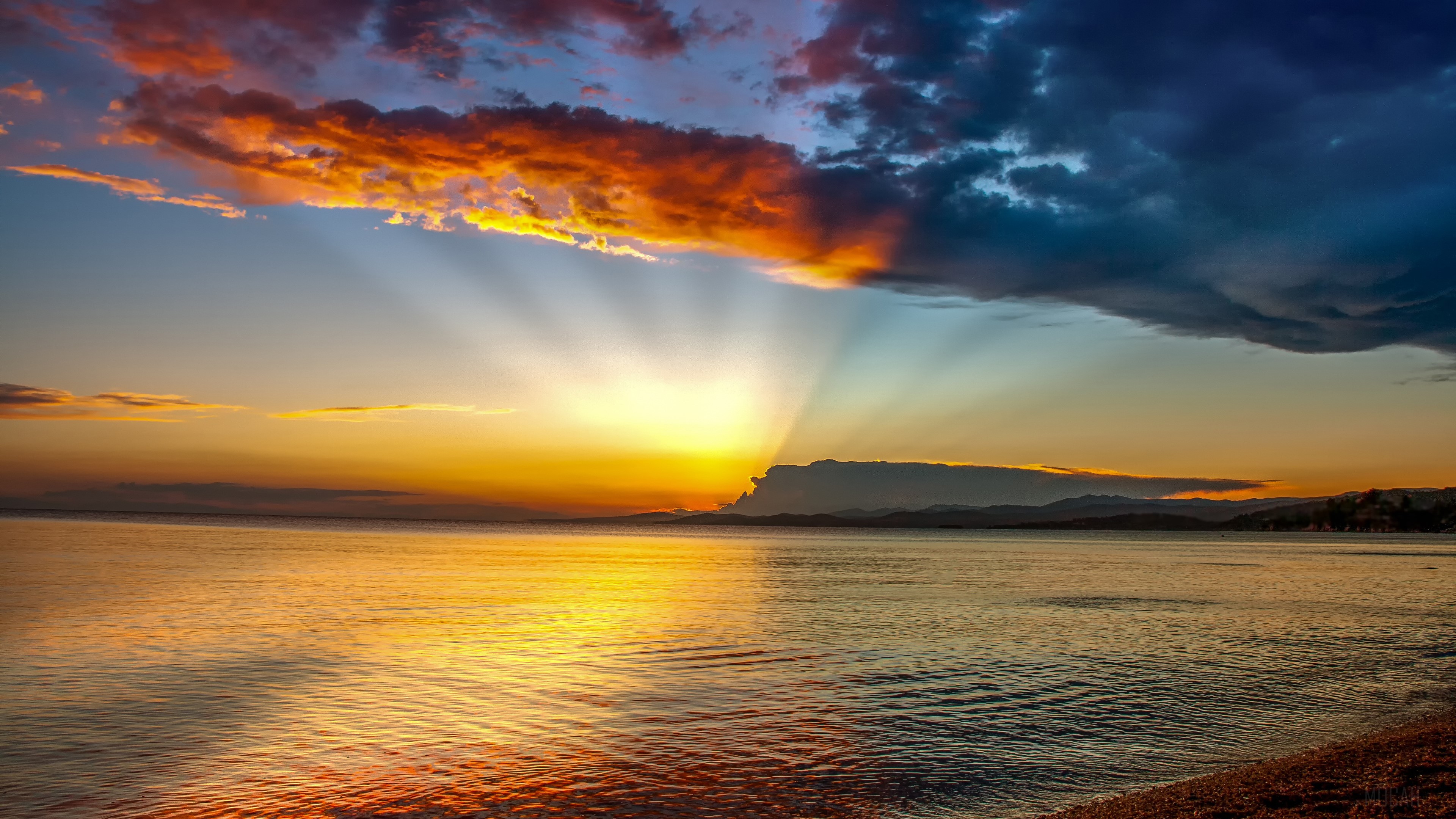 Sunset over the ocean with dramatic clouds HD Wallpaper