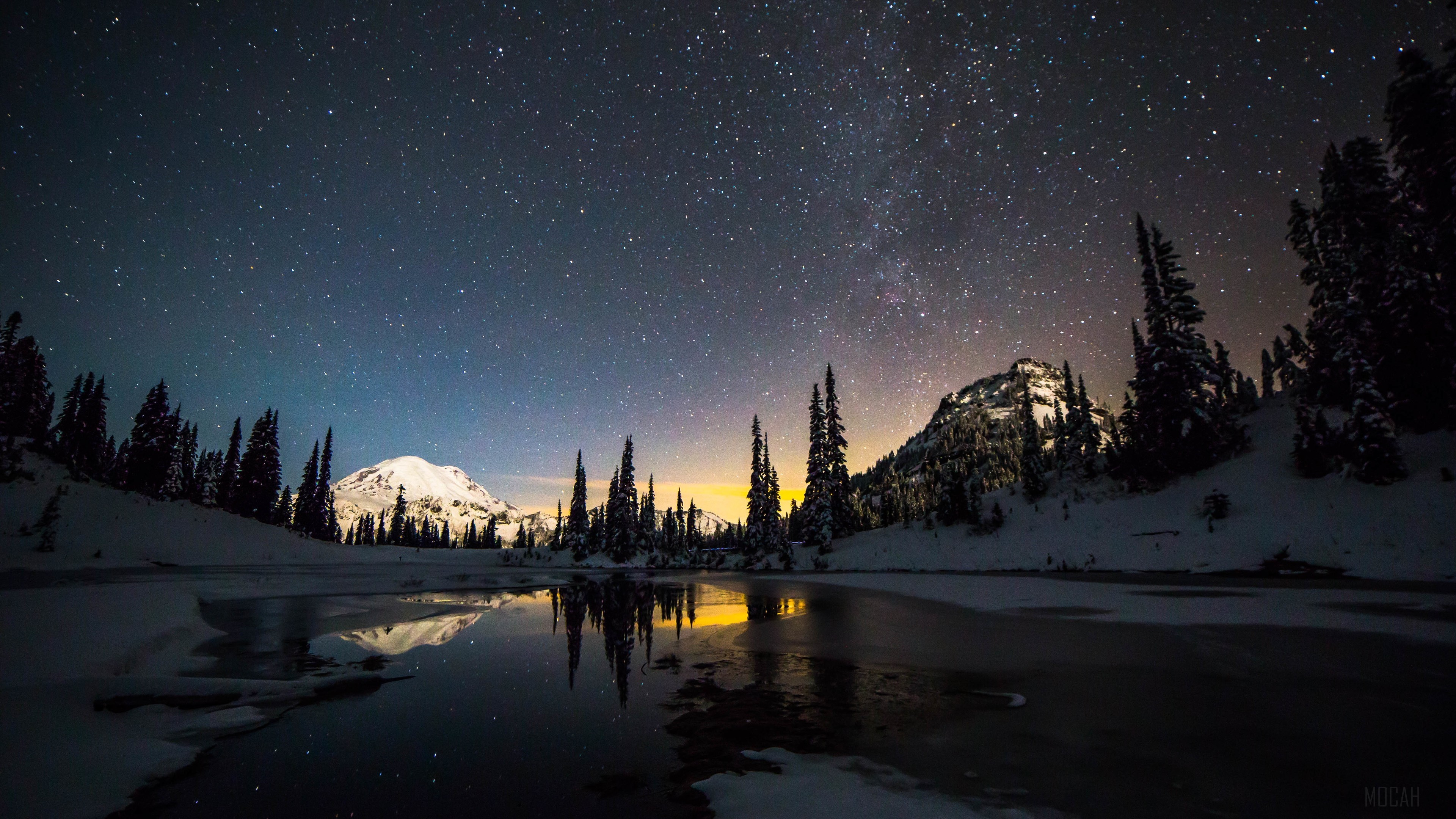 Snowy Mountains Under a Starry Galaxy Sky 4K HD Wallpaper