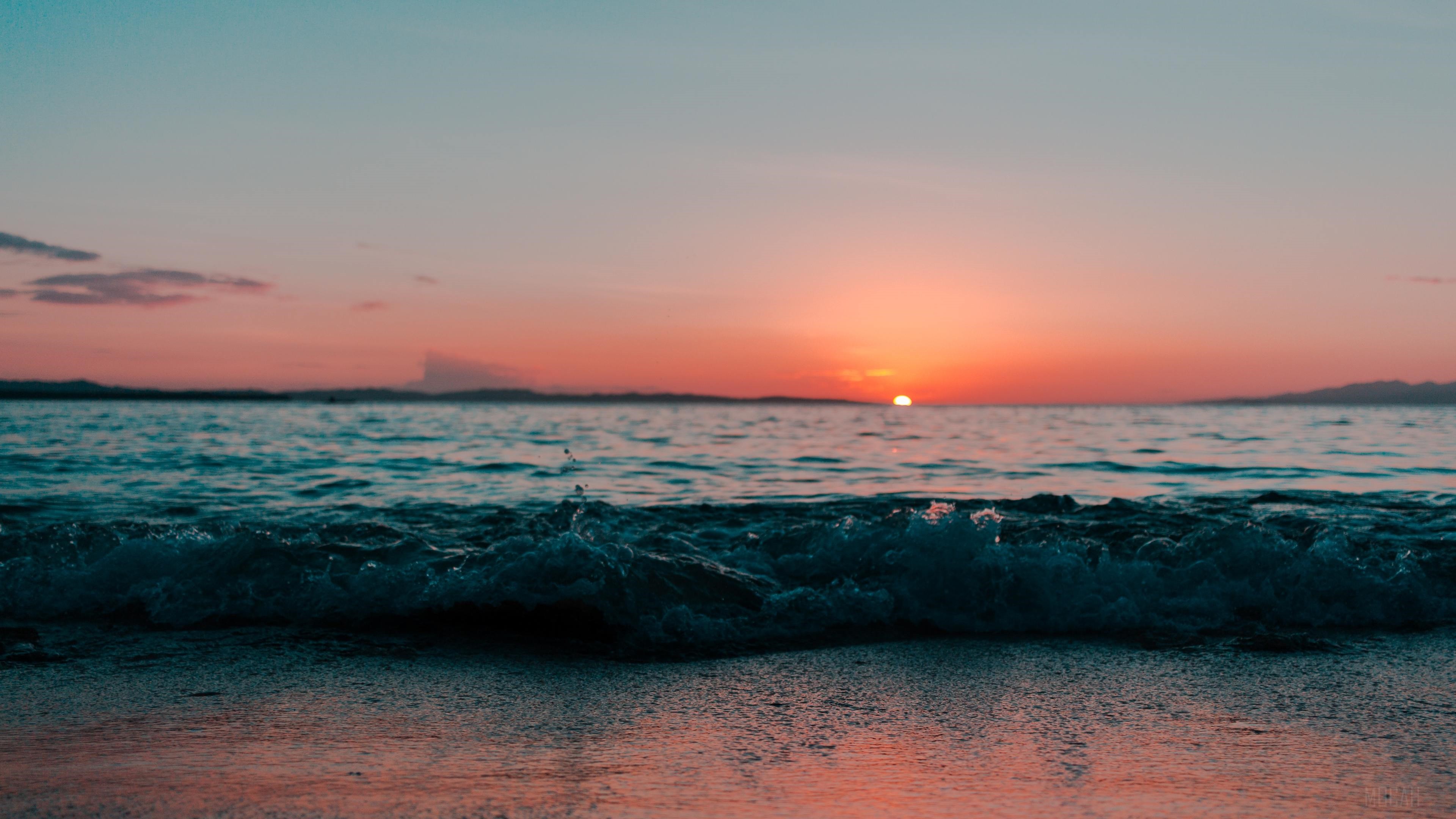 Calm Ocean Shore at Sunset 4K HD Wallpaper