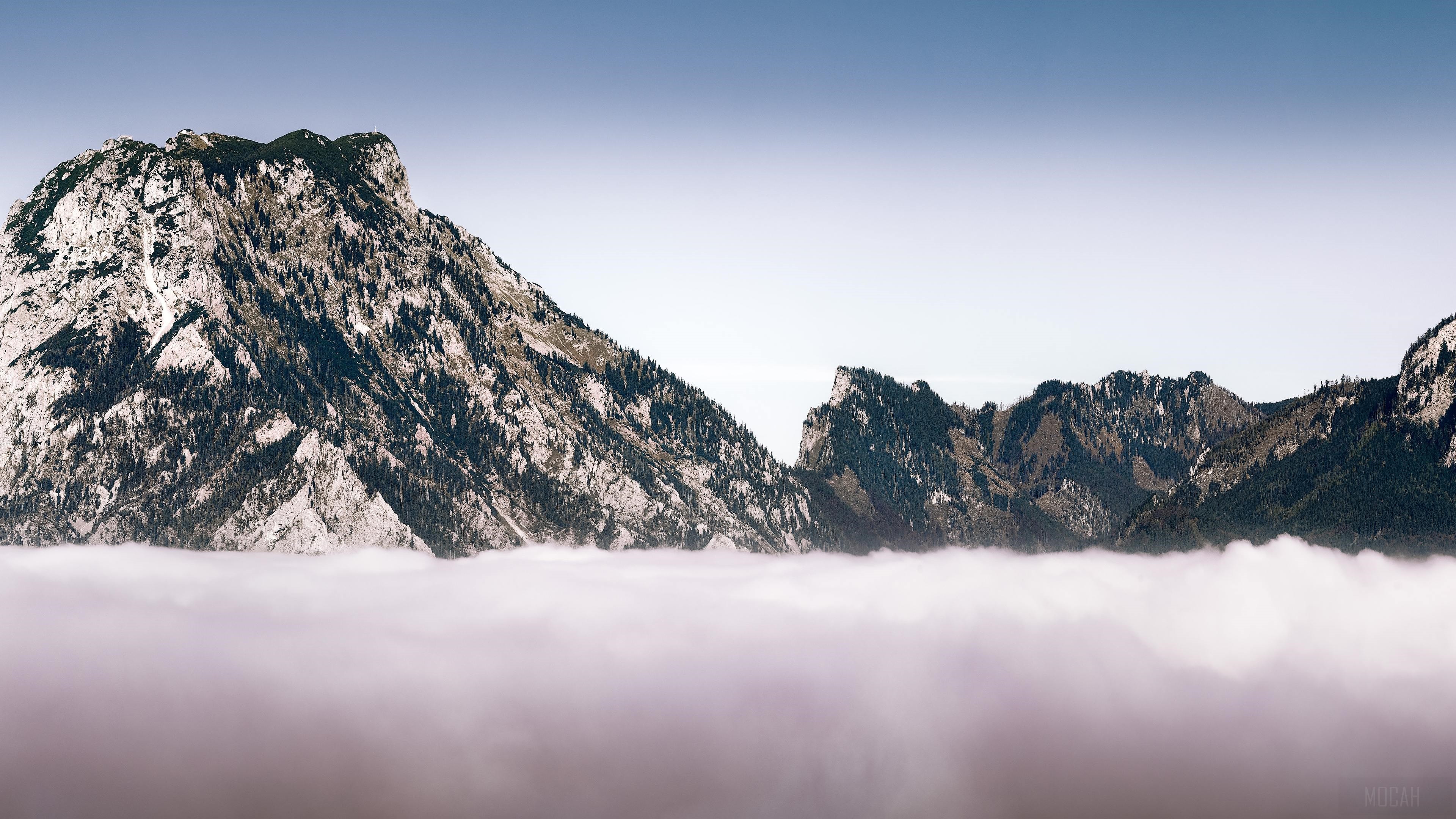 Mountains above clouds in winter 4K HD Wallpaper