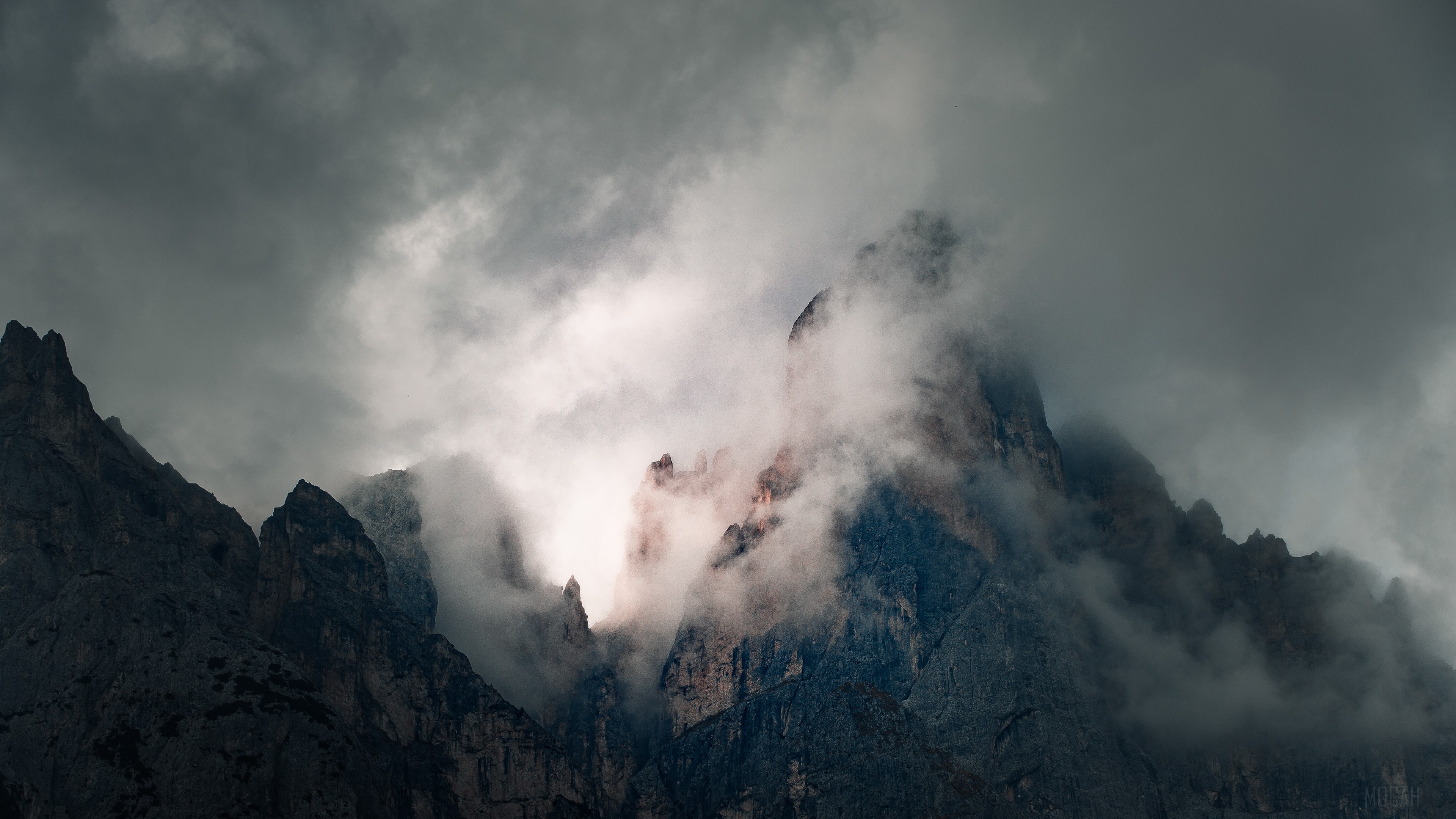 Mountains shrouded in fog during a cloudy morning HD Wallpaper