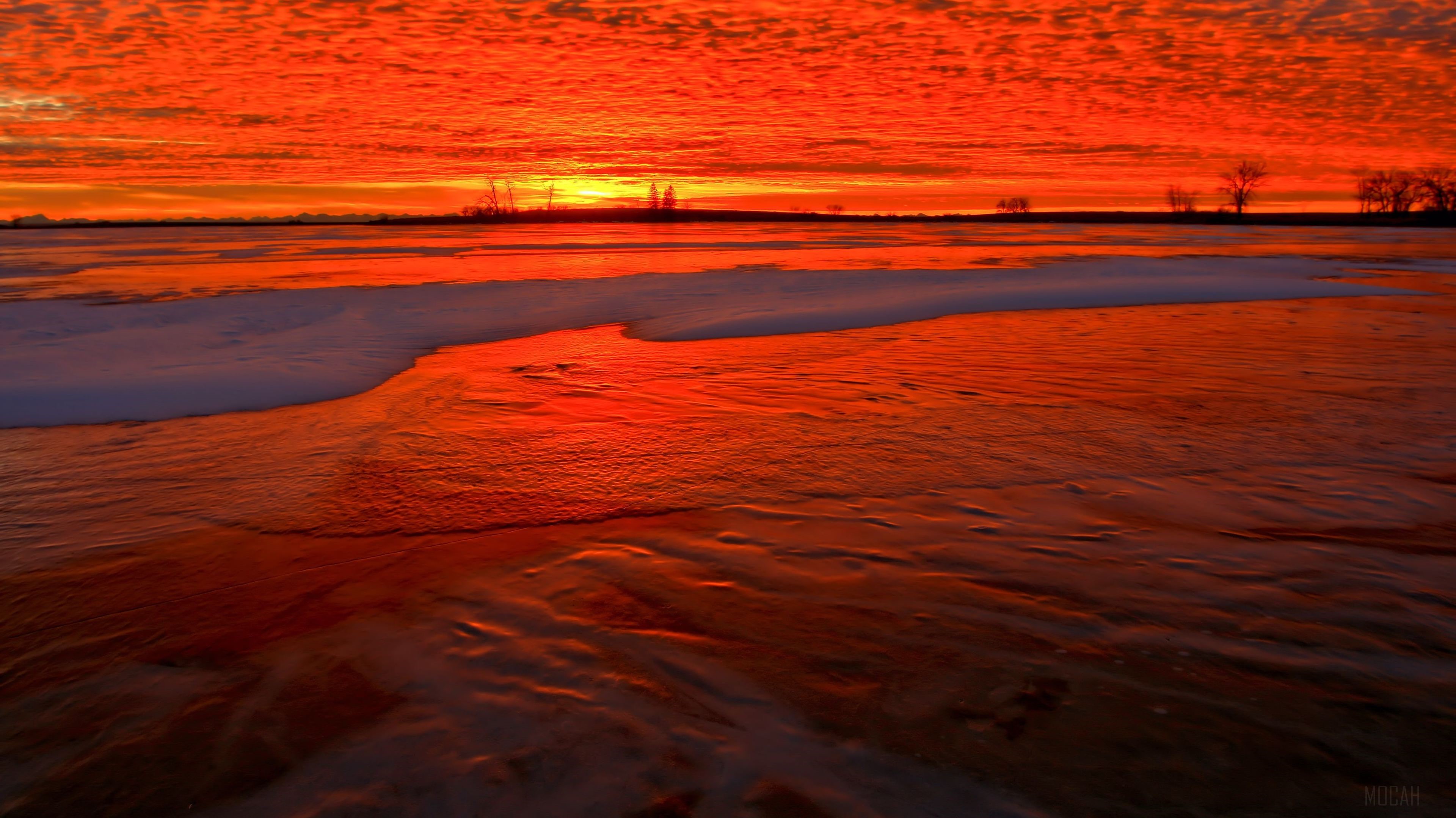 Red Sunset Over Frozen Landscape 4K HD Wallpaper