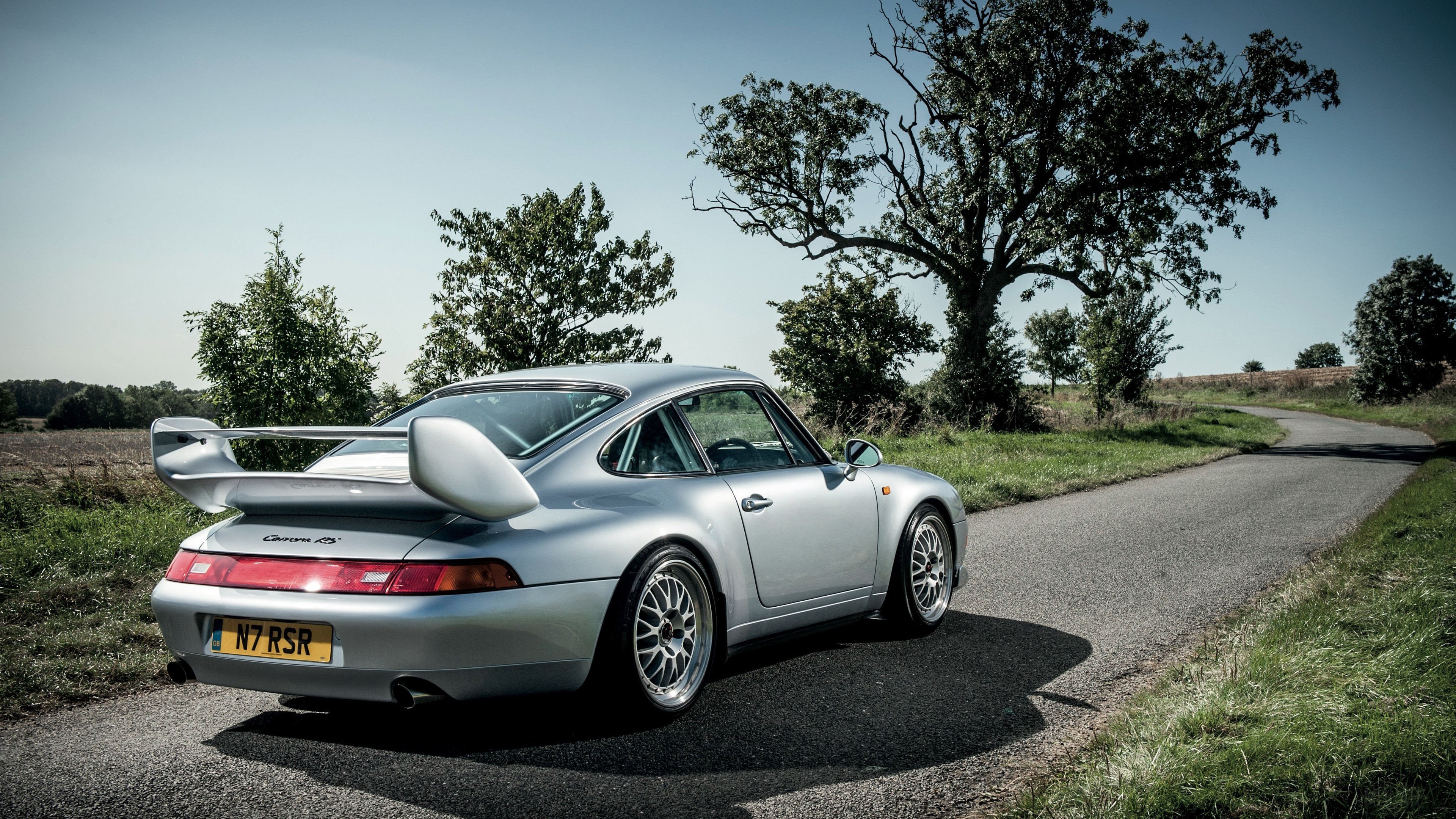 Silver Porsche 911 Carrera RS on a Country Road HD Wallpaper