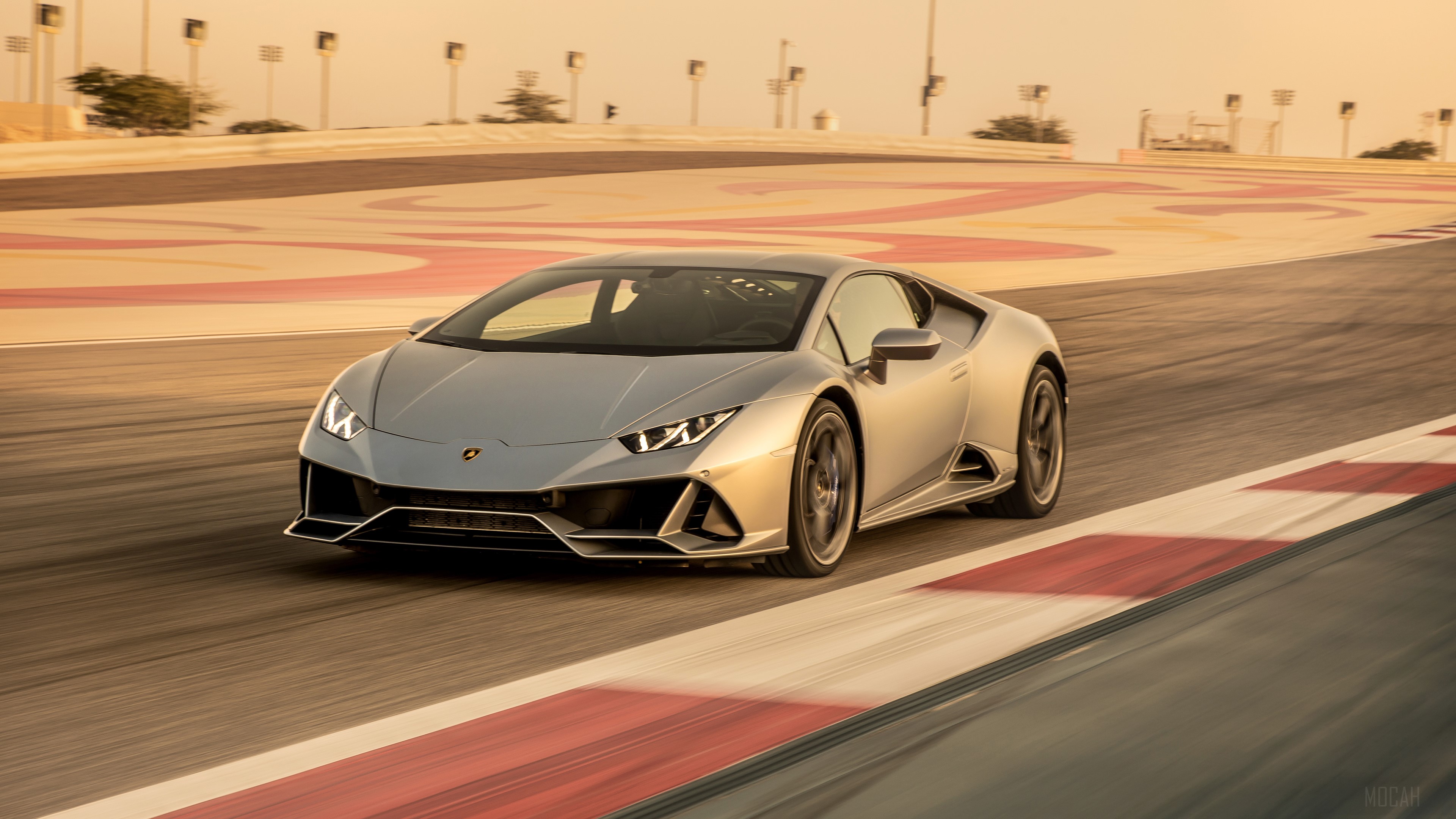Silver Lamborghini Huracan Evo on a race track HD Wallpaper