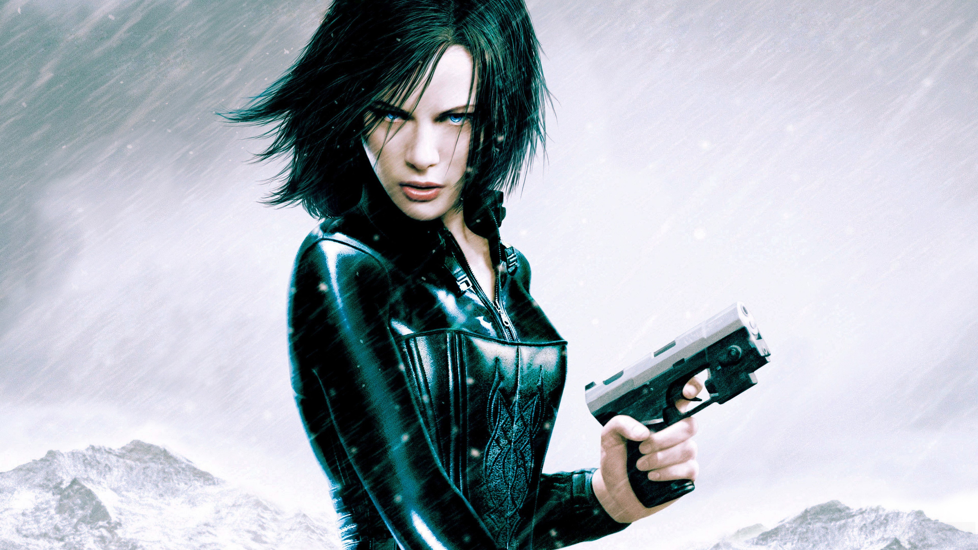 Selene from Underworld holding a gun in the snow HD Wallpaper