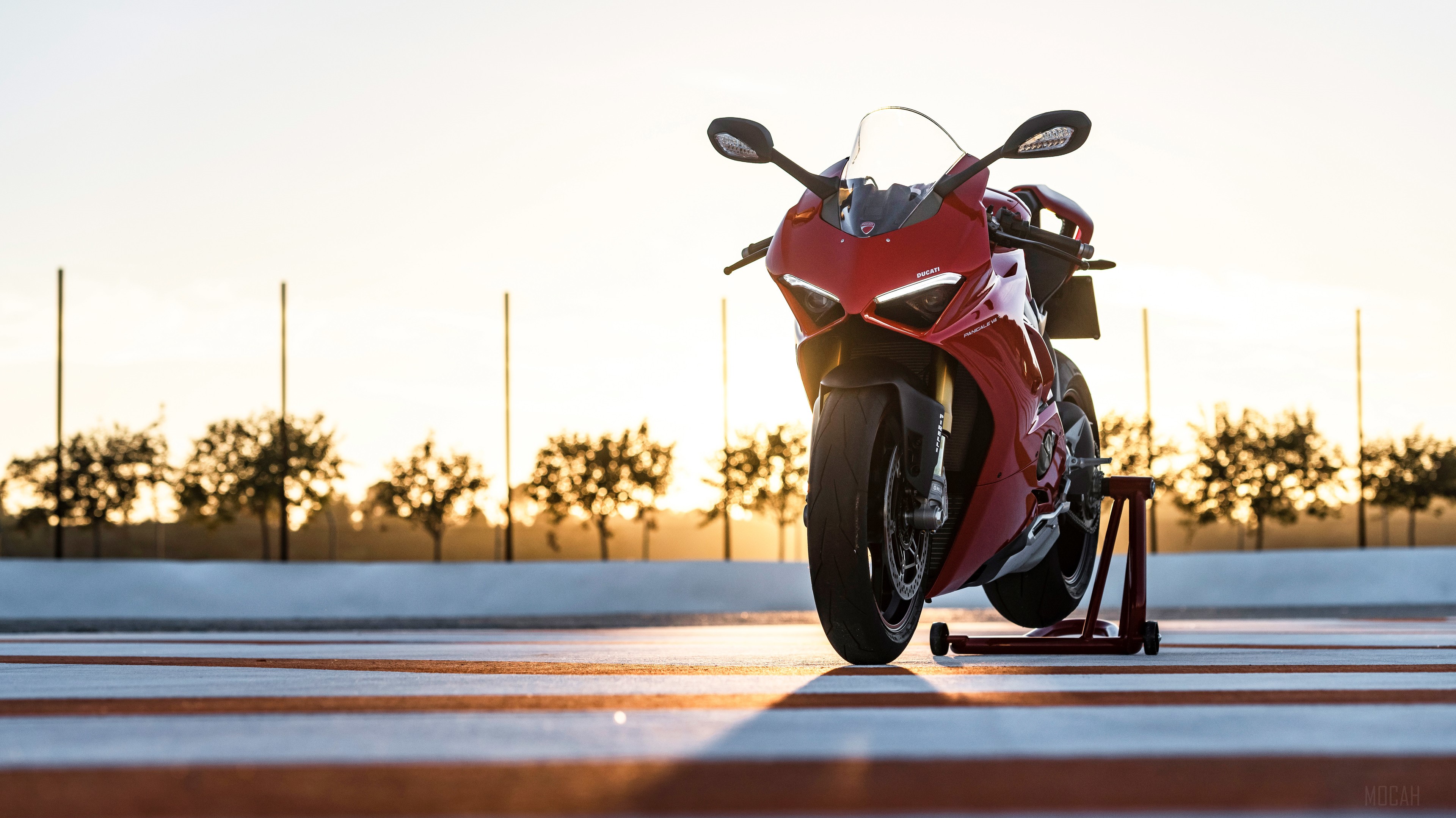 Red Ducati Panigale V4 motorcycle on a stand HD Wallpaper