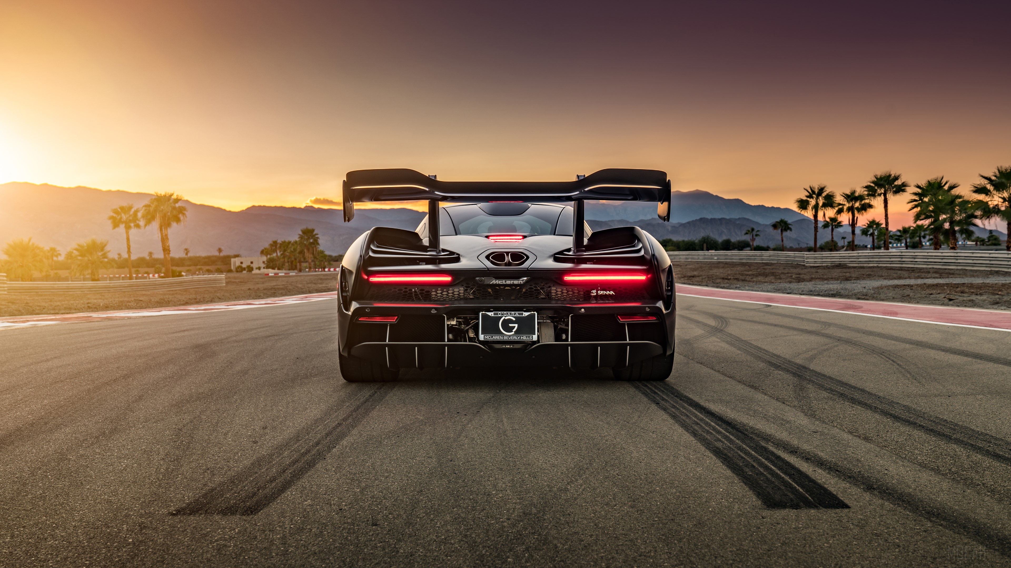 McLaren Senna GTR on a racetrack at sunset HD Wallpaper