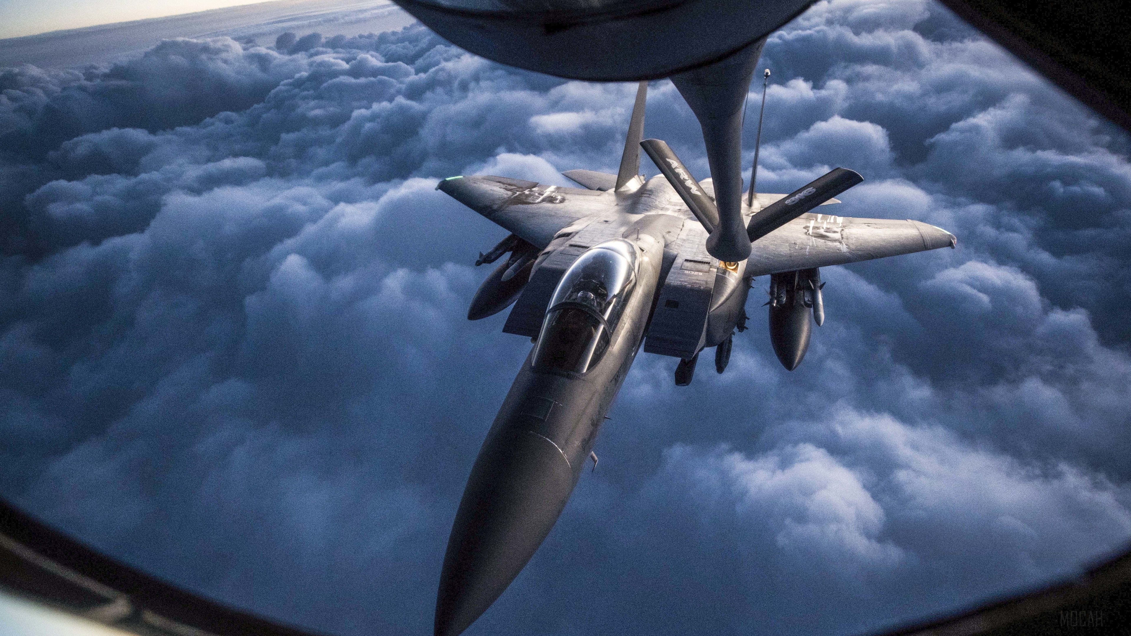 McDonnell Douglas F-15 Eagle refueling in clouds 4K HD Wallpaper