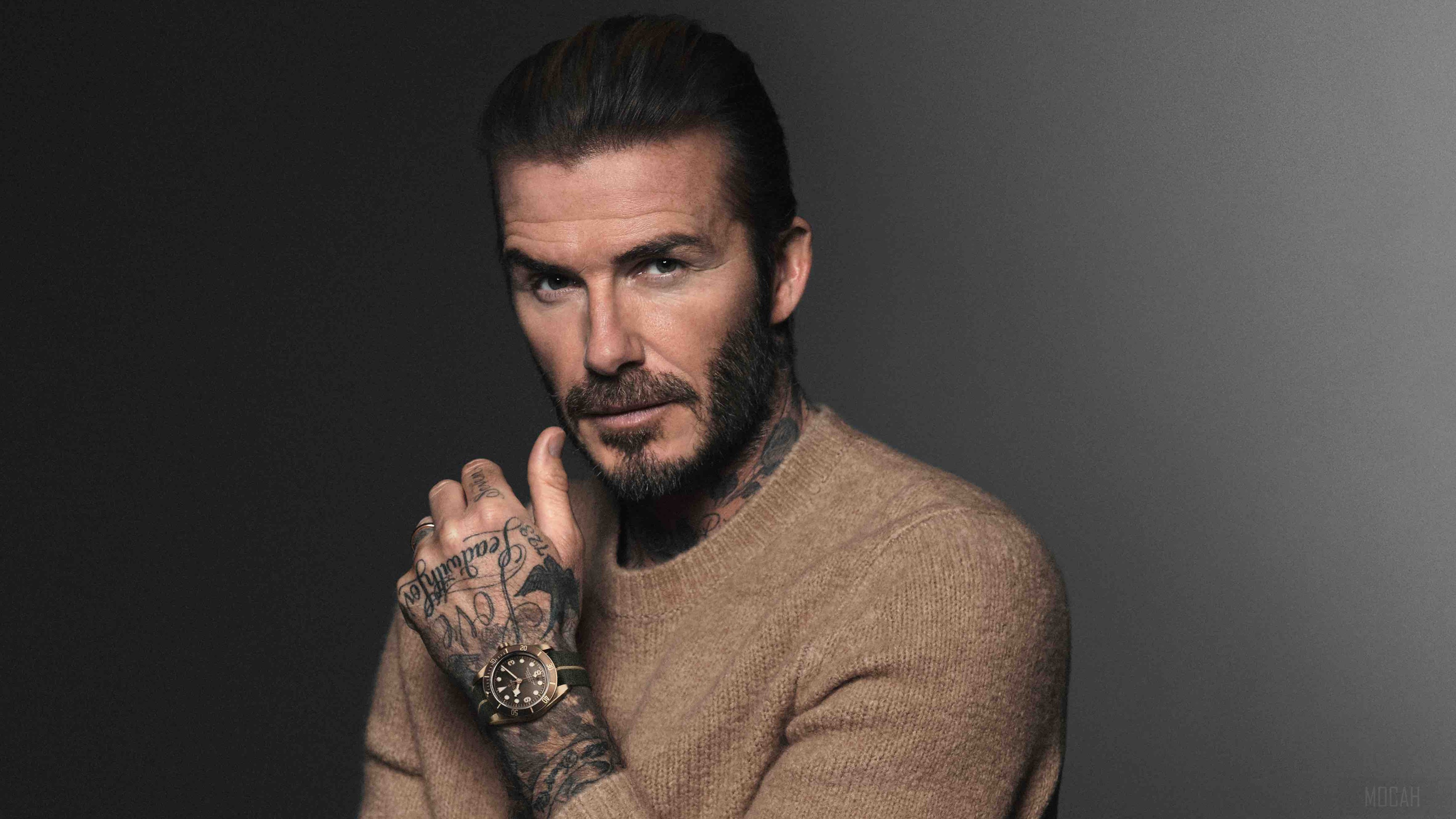 David Beckham wearing a tan sweater and watch HD Wallpaper