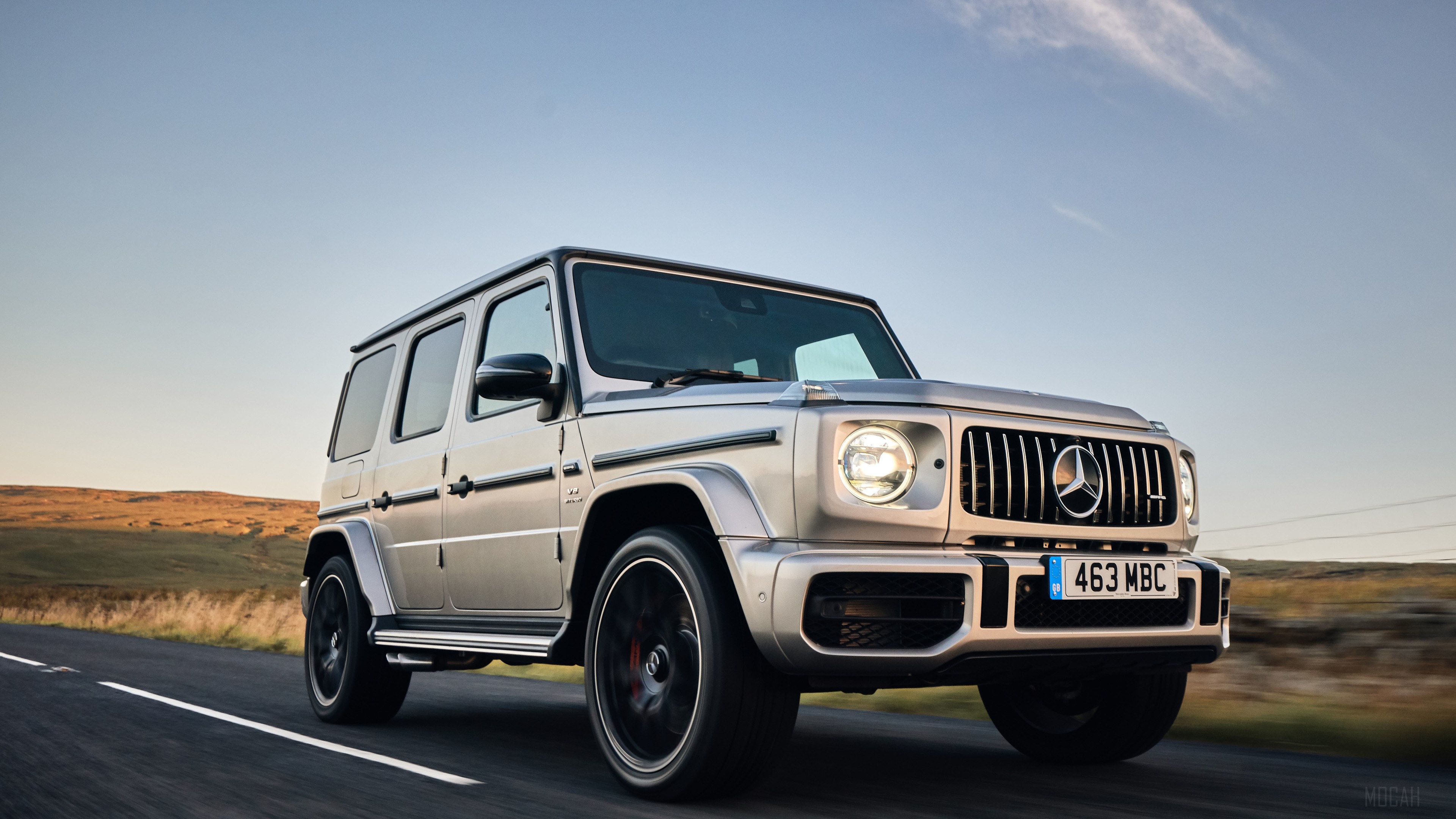 Mercedes-AMG G63 on a road HD Wallpaper