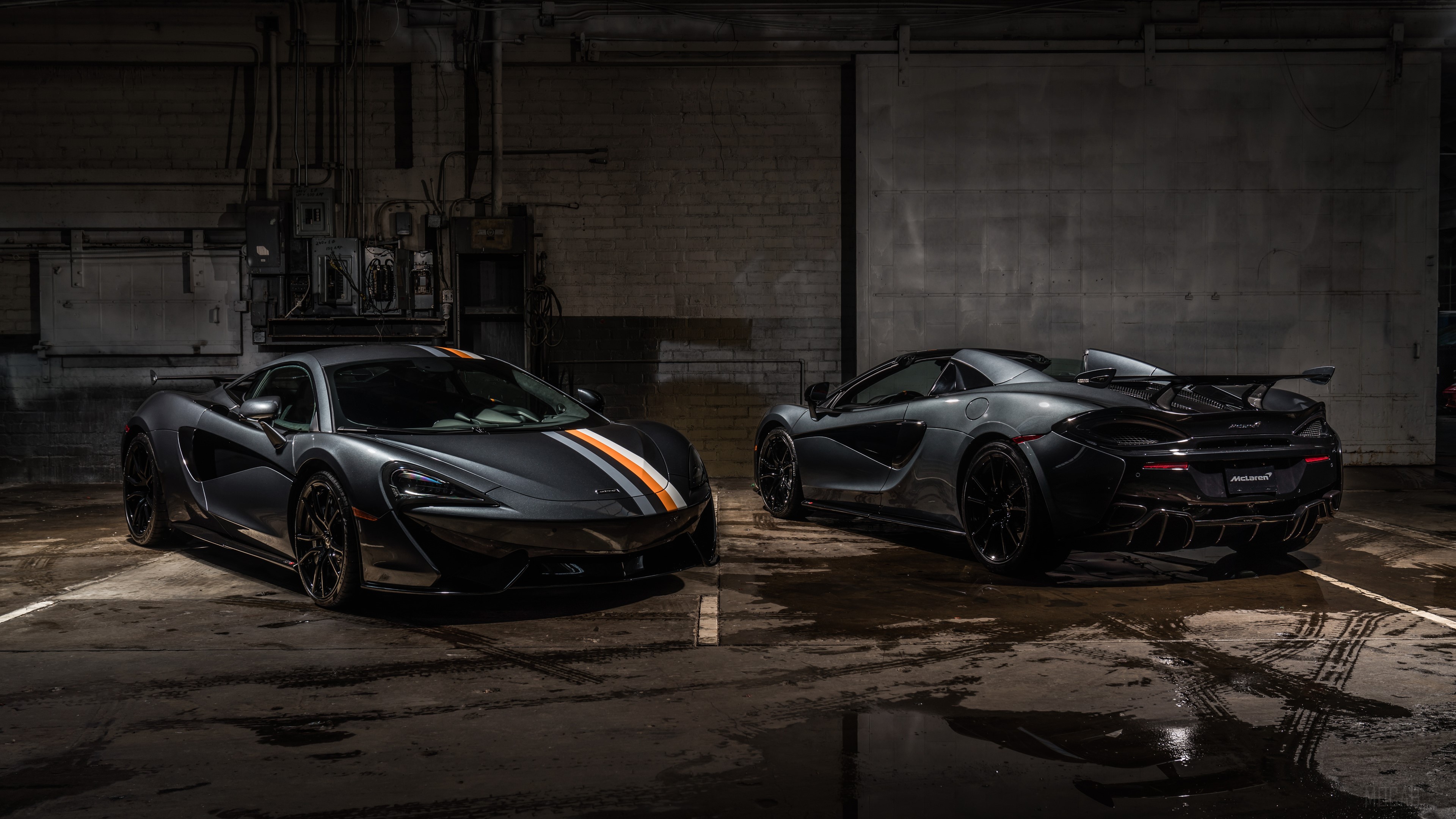 Two McLaren MSO 570S Coupes in a garage HD Wallpaper