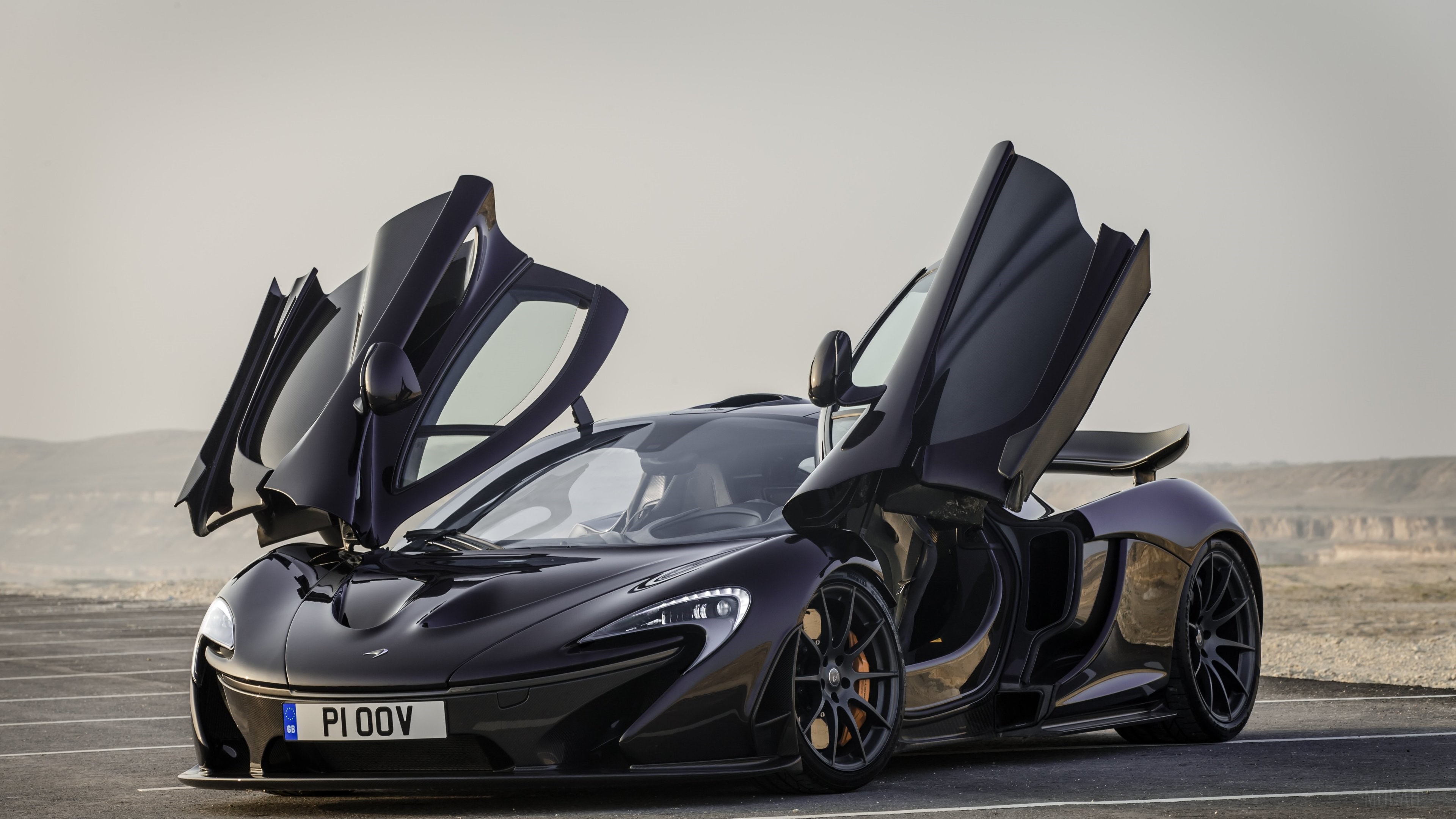 Black McLaren P1 with doors open 4K HD Wallpaper