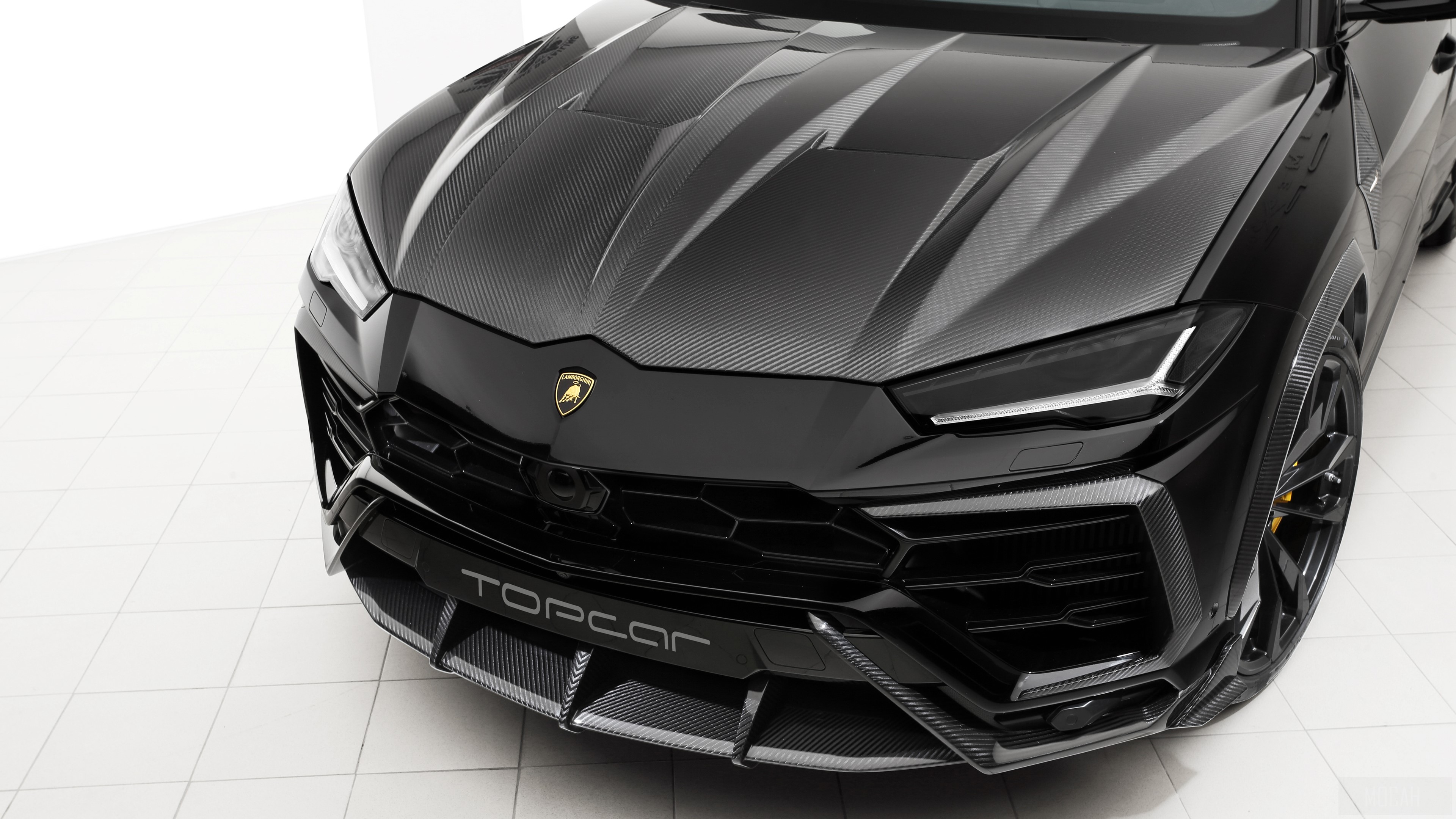 Black Lamborghini Urus with Carbon Fiber Accents HD Wallpaper
