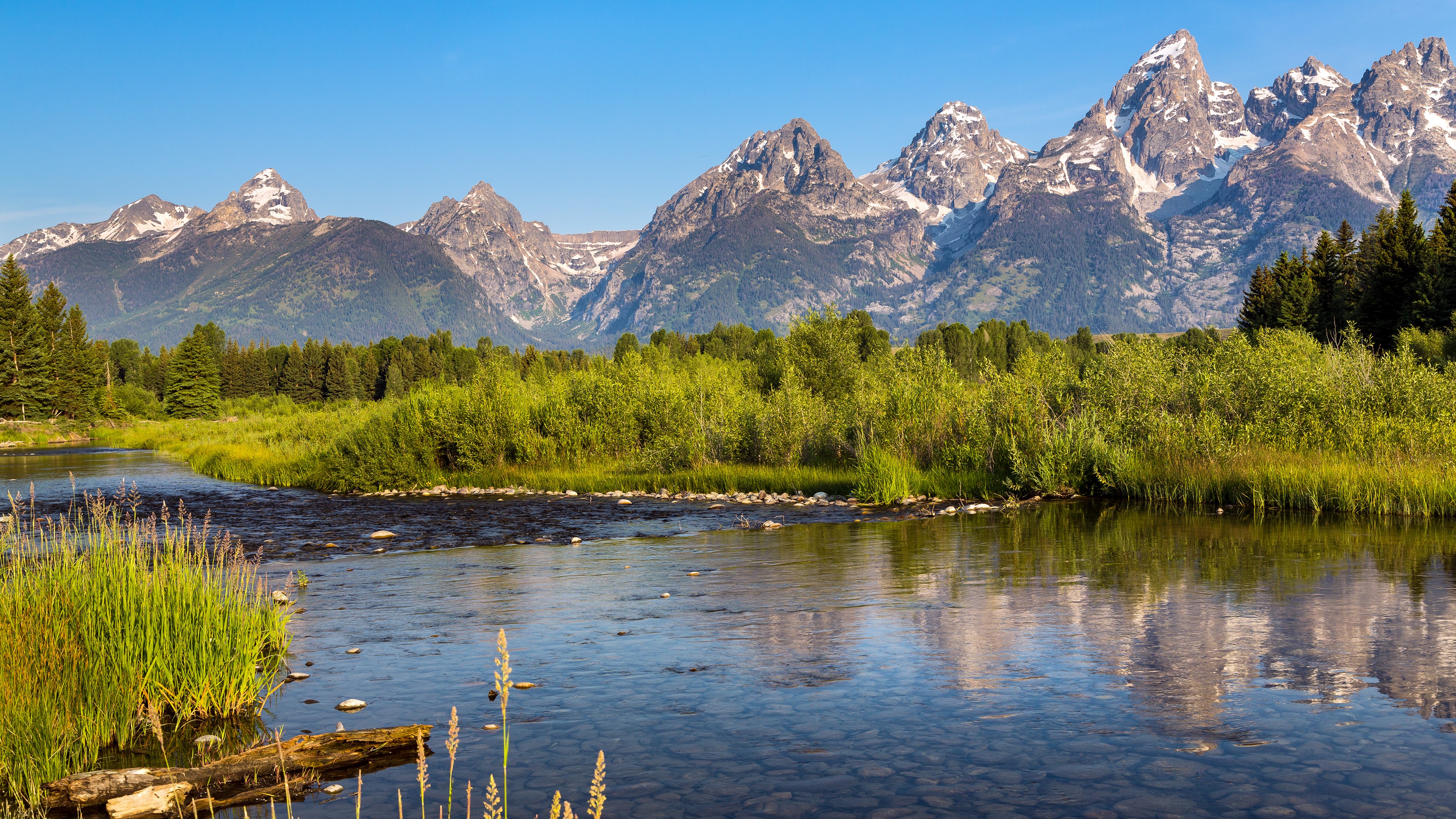 Grand Teton Mountains reflected in a river HD Wallpaper