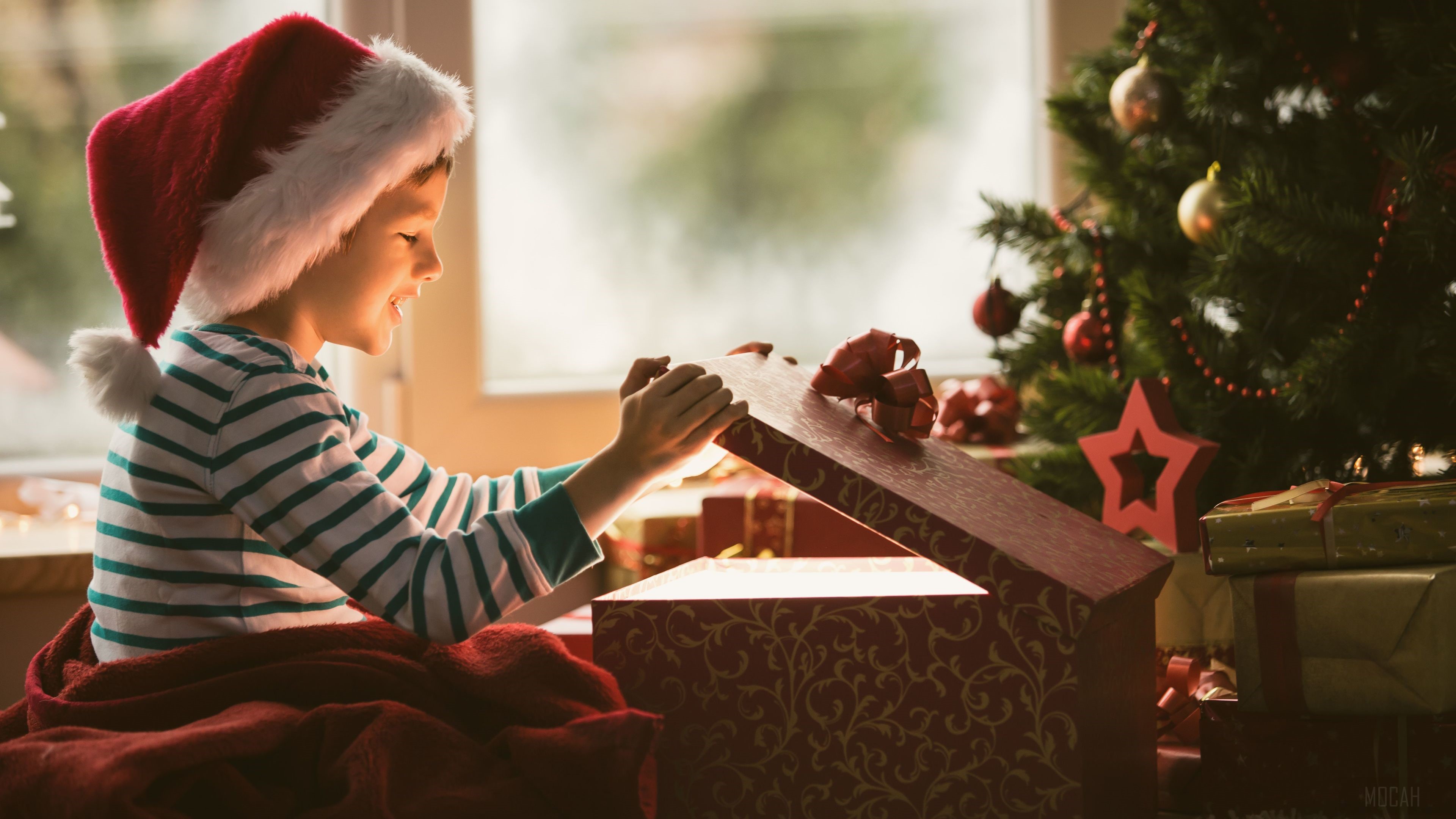 Boy Opening Christmas Present HD Wallpaper