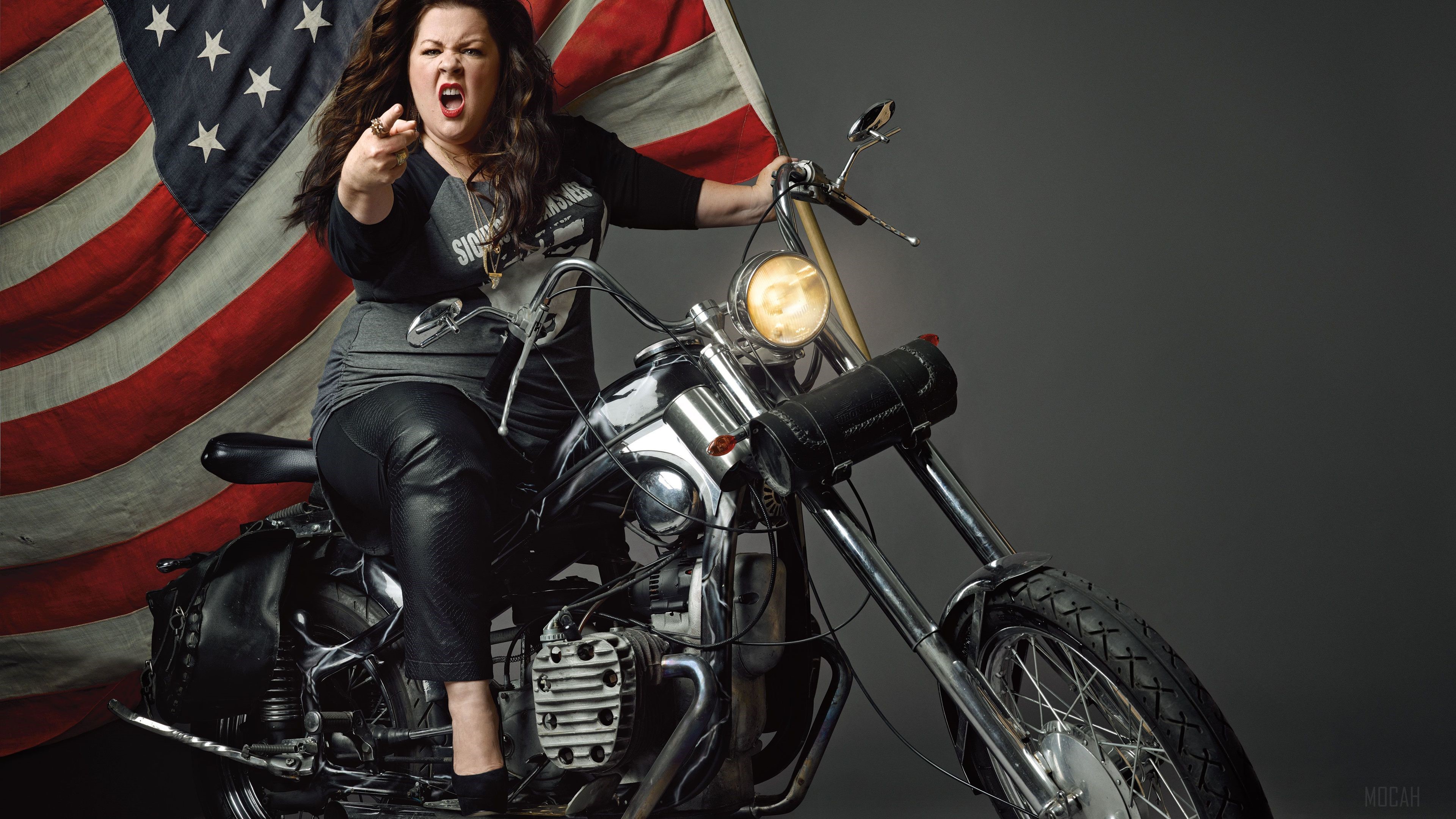 Melissa McCarthy on a motorcycle with American flag HD Wallpaper