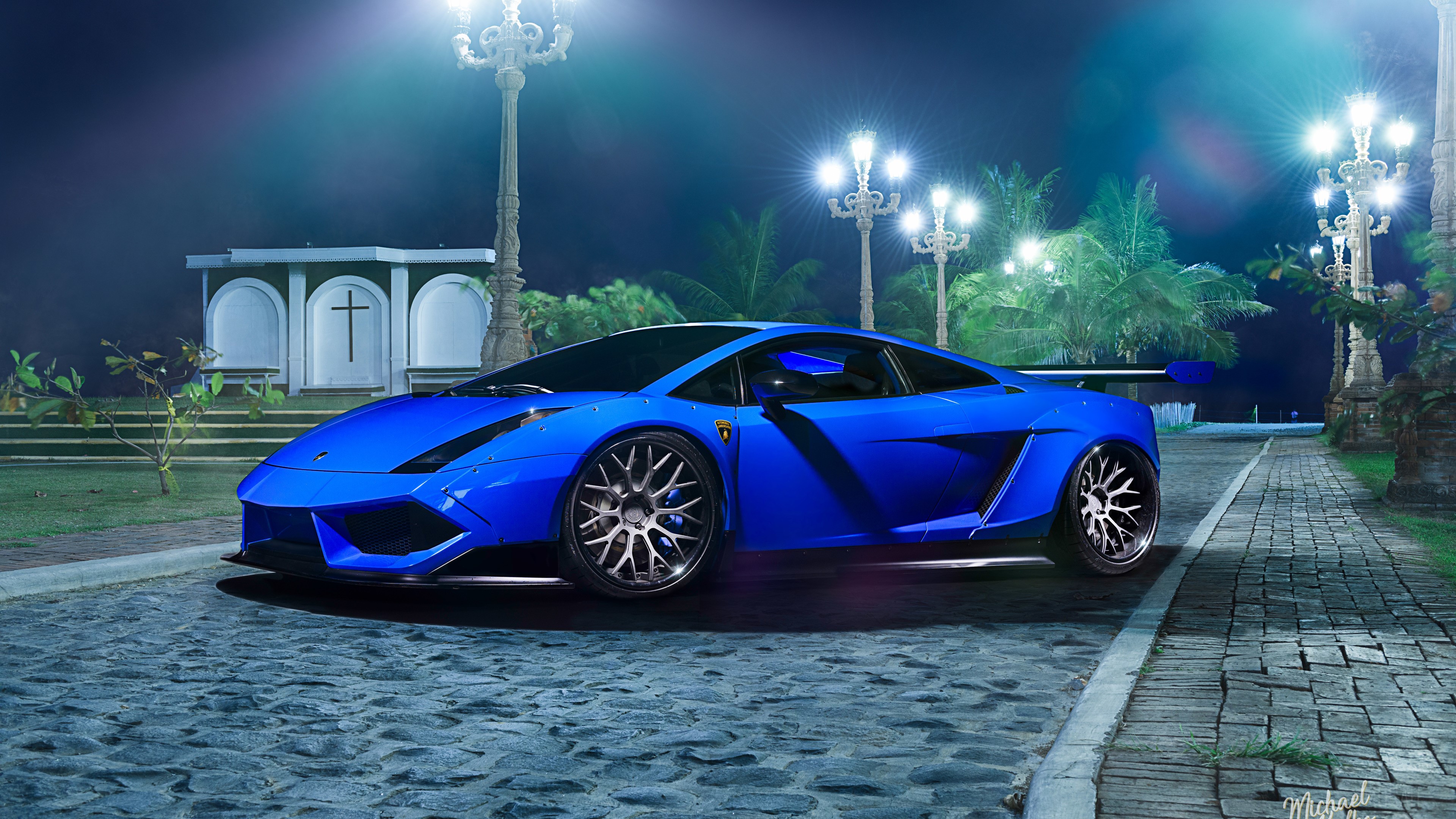 Blue Lamborghini Gallardo on cobblestone street at night HD Wallpaper