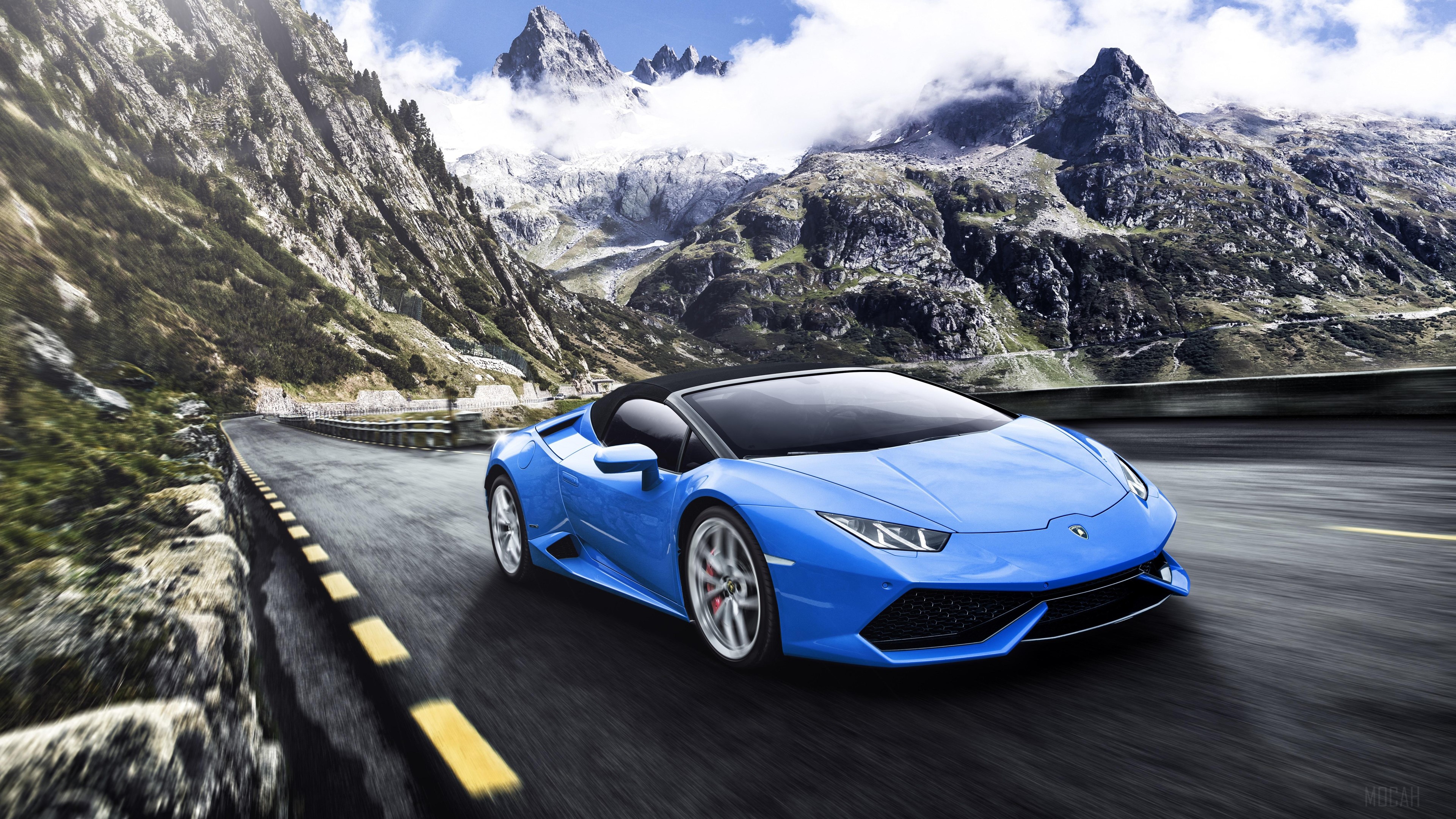 Blue Lamborghini Huracan convertible on mountain road 4K HD Wallpaper