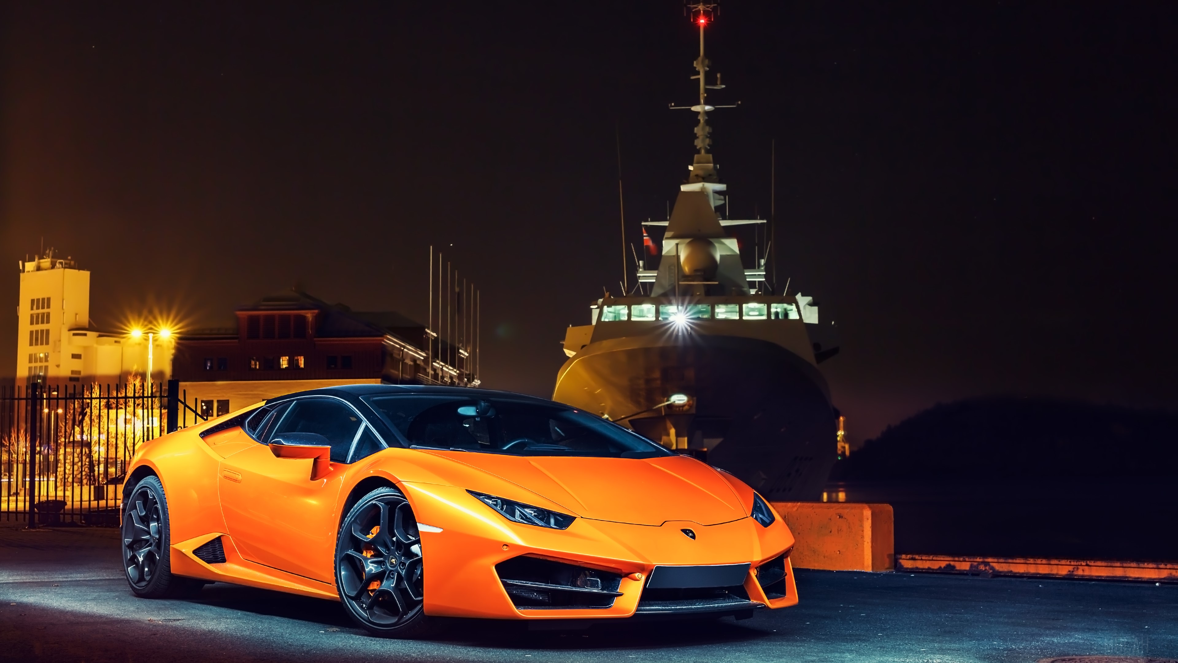Orange Lamborghini Huracan LP580 parked by a ship at night HD Wallpaper