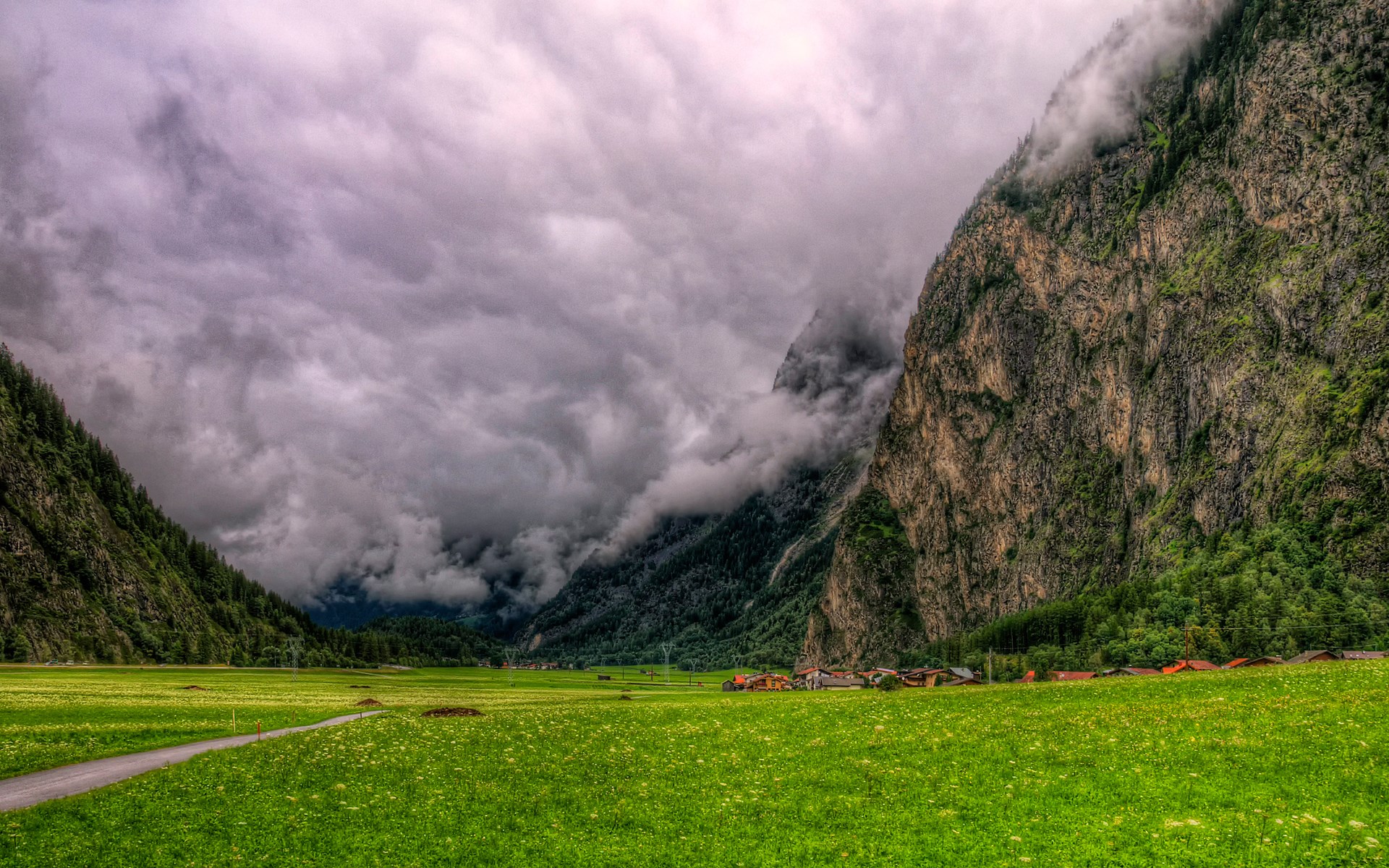 Valley with mountains and a village HD Wallpaper